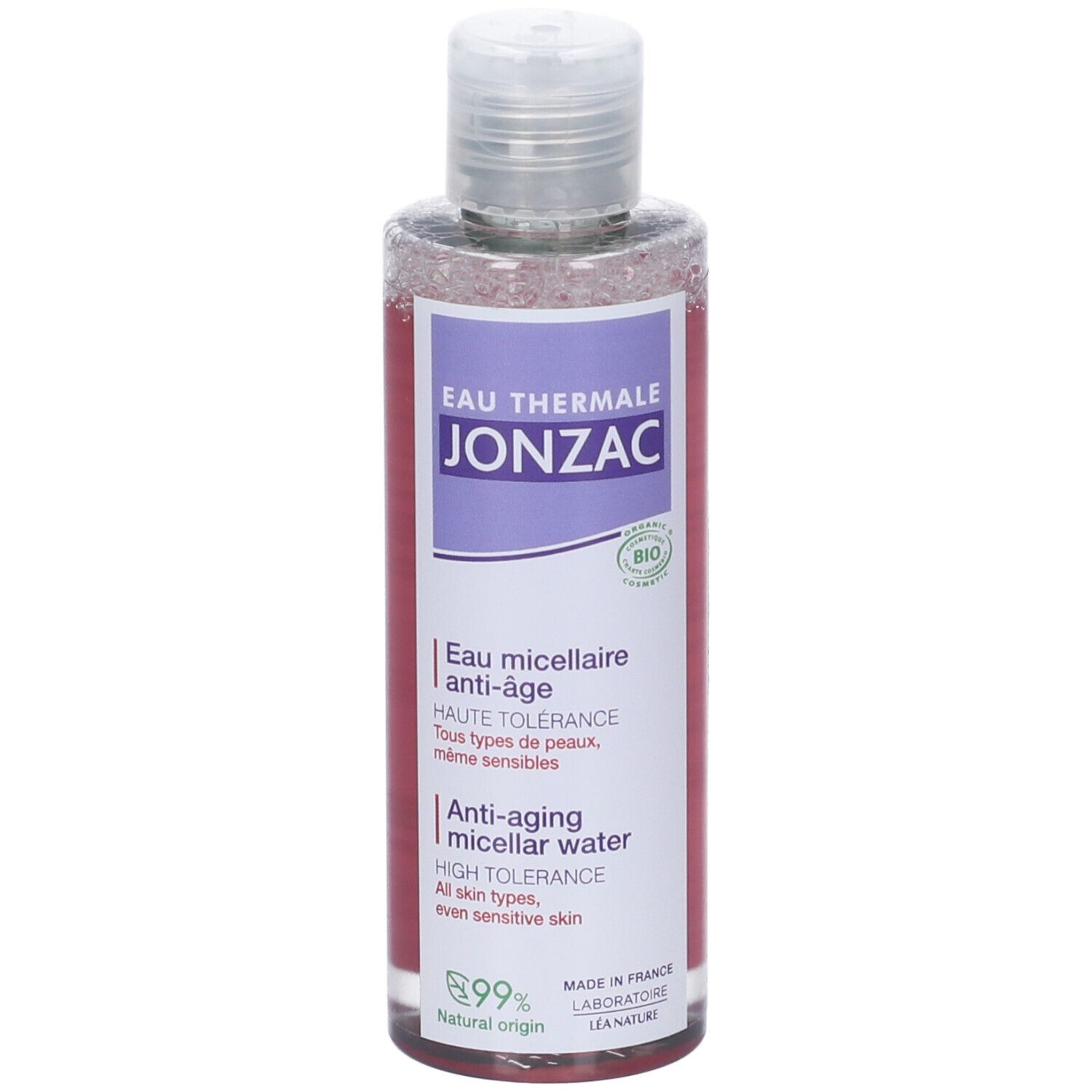 Flacone trasparente con etichetta viola. Testo: JONZAC, Eau Thermale, Anti-âge. Certificazione bio. Tappo e collo trasparenti.