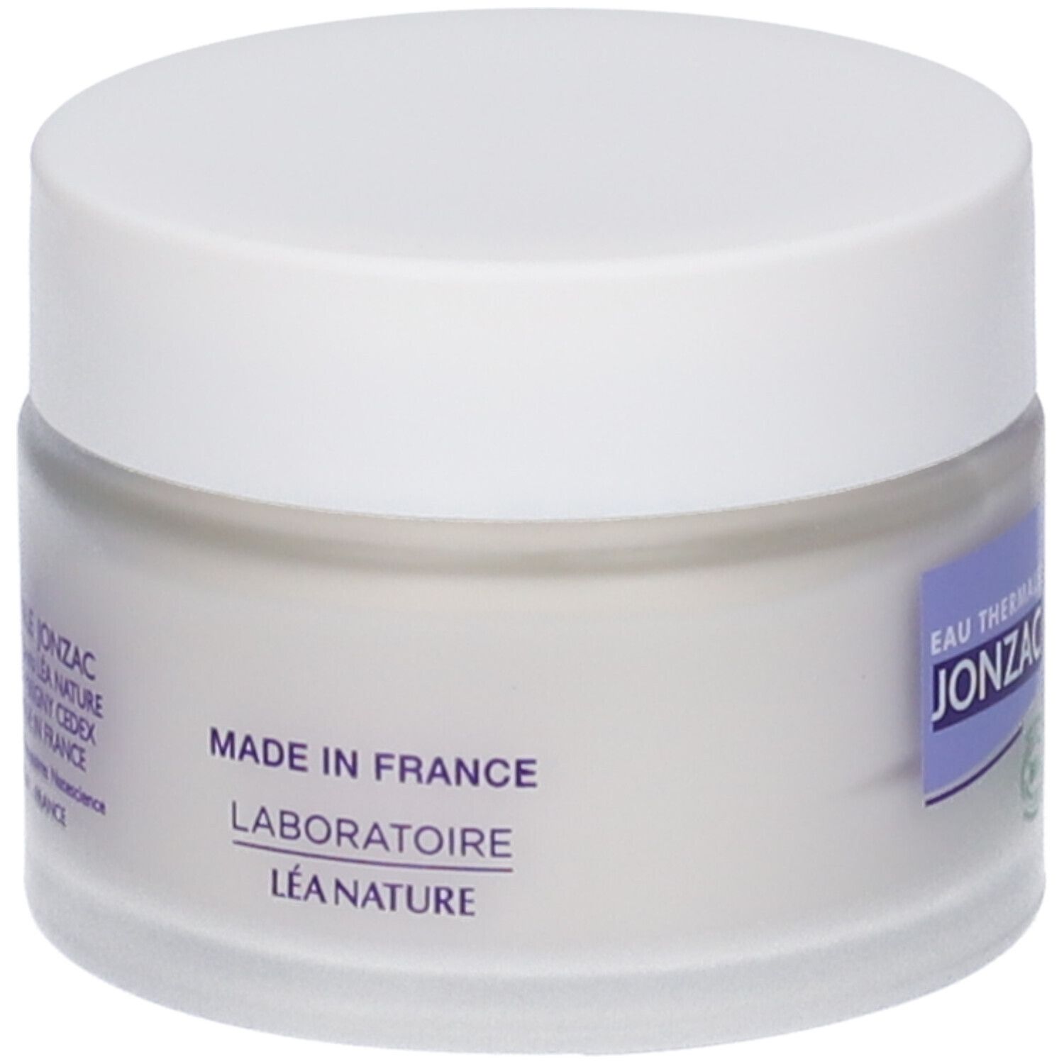 Vasetto di crema con coperchio bianco. Etichetta con testo: Made in France, Laboratoire Léa Nature. Logo e testo Eau Thermale Jonzac.