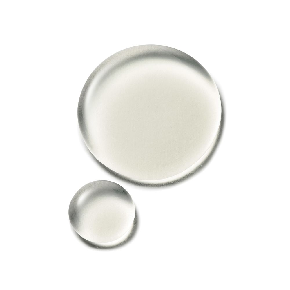 Due gocce di siero. Due gocce rotonde trasparenti su sfondo bianco. Una più piccola e una più grande.