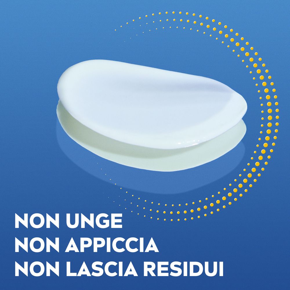 Crema su sfondo blu. Testo: Non unge, non appiccica, non lascia residui.