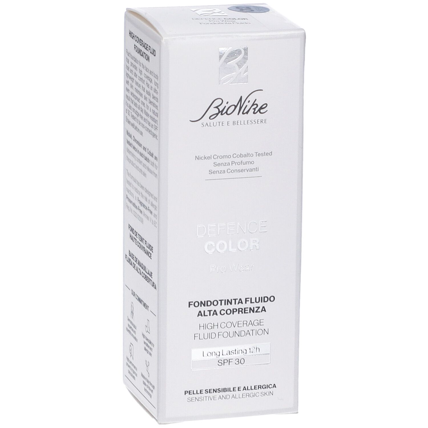 Scatola bianca. Logo Bionike. Defence Color Pro Wear Fondotinta Fluido Alta Coprenza. Testo: SPF 30, pelle sensibile.