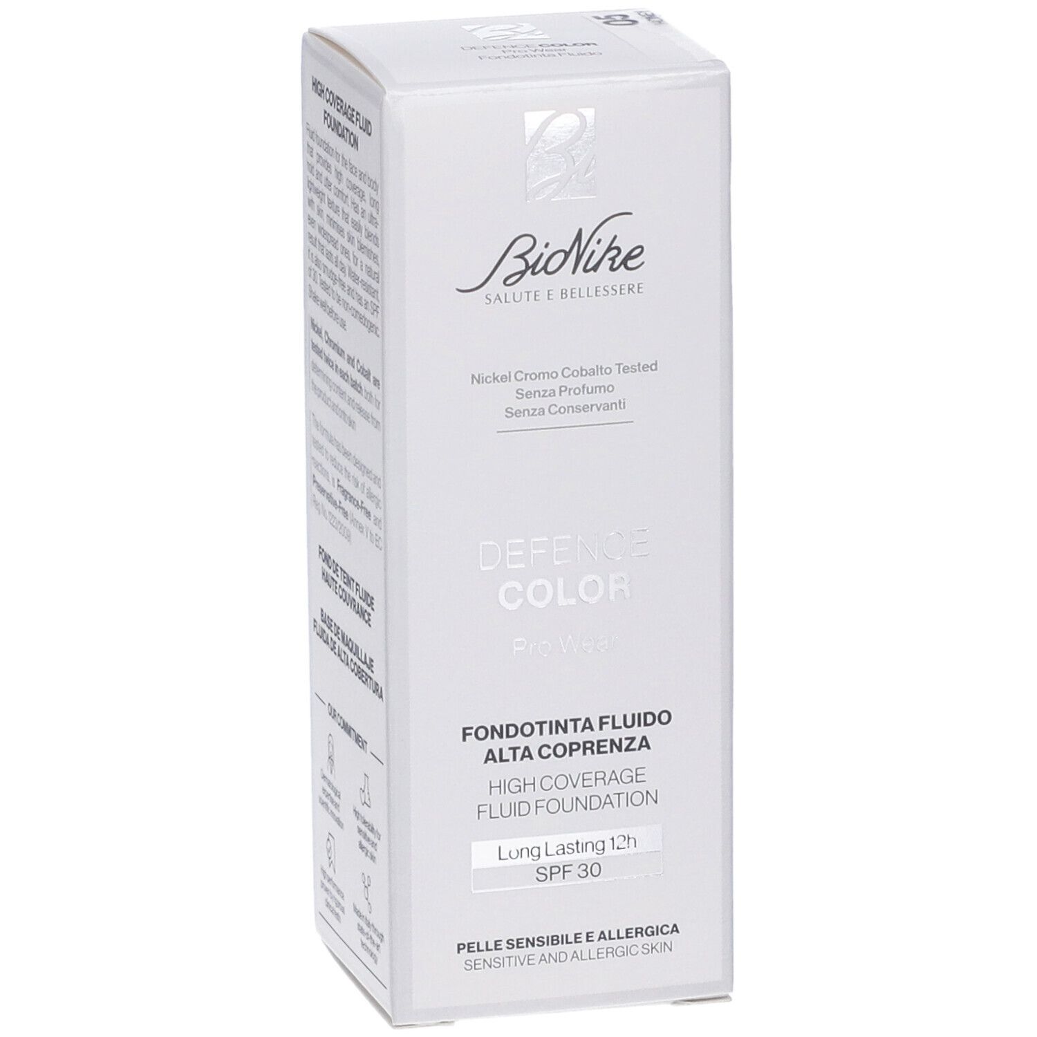 Bionike Defence Color Pro Wear Fondotinta Fluido. Confezione bianca. Testo: Fondotinta Fluido Alta Coprenza, SPF 30. Marchio visibile.