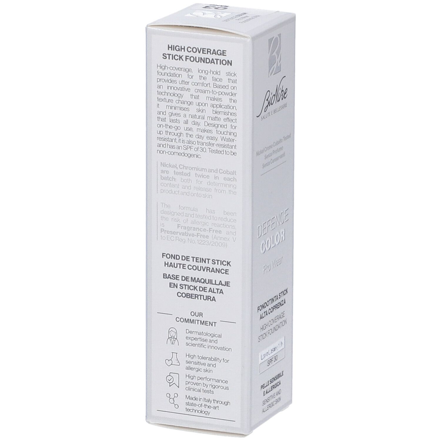Confezione bianca con testo. 'High Coverage Stick Foundation', descrizione del prodotto, ingredienti e icone.