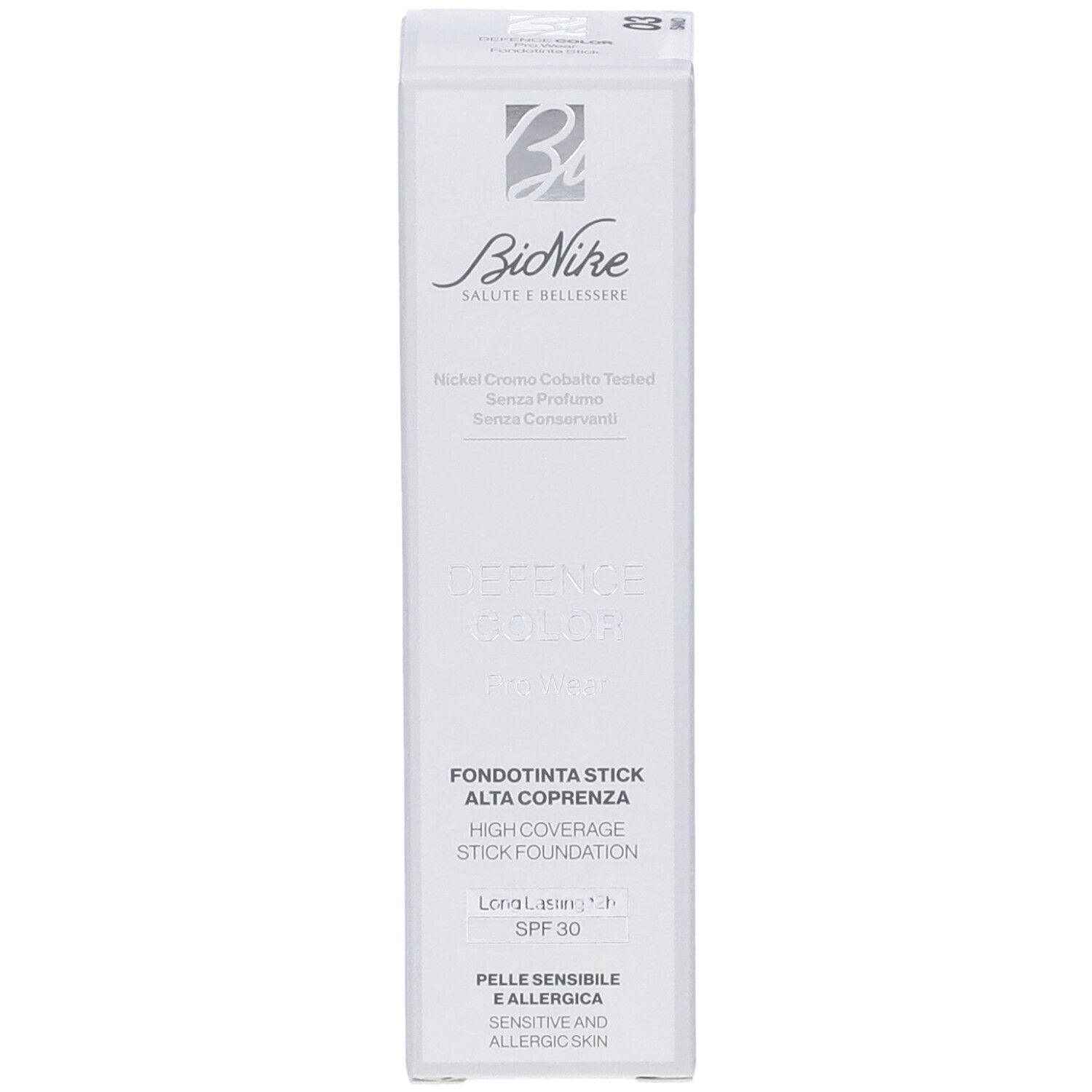 Confezione bianca con informazioni prodotto. Logo Bionike, scritta 'Defence Color', 'Fondotinta Stick Alta Coprenza', SPF 30.