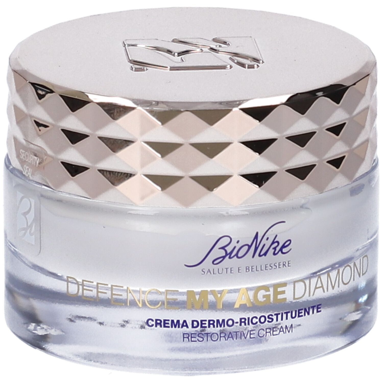 Vasetto di crema con coperchio argentato. Scritte: "DEFENCE MY AGE DIAMOND" e "CREMA DERMO-RICOSTITUENTE".