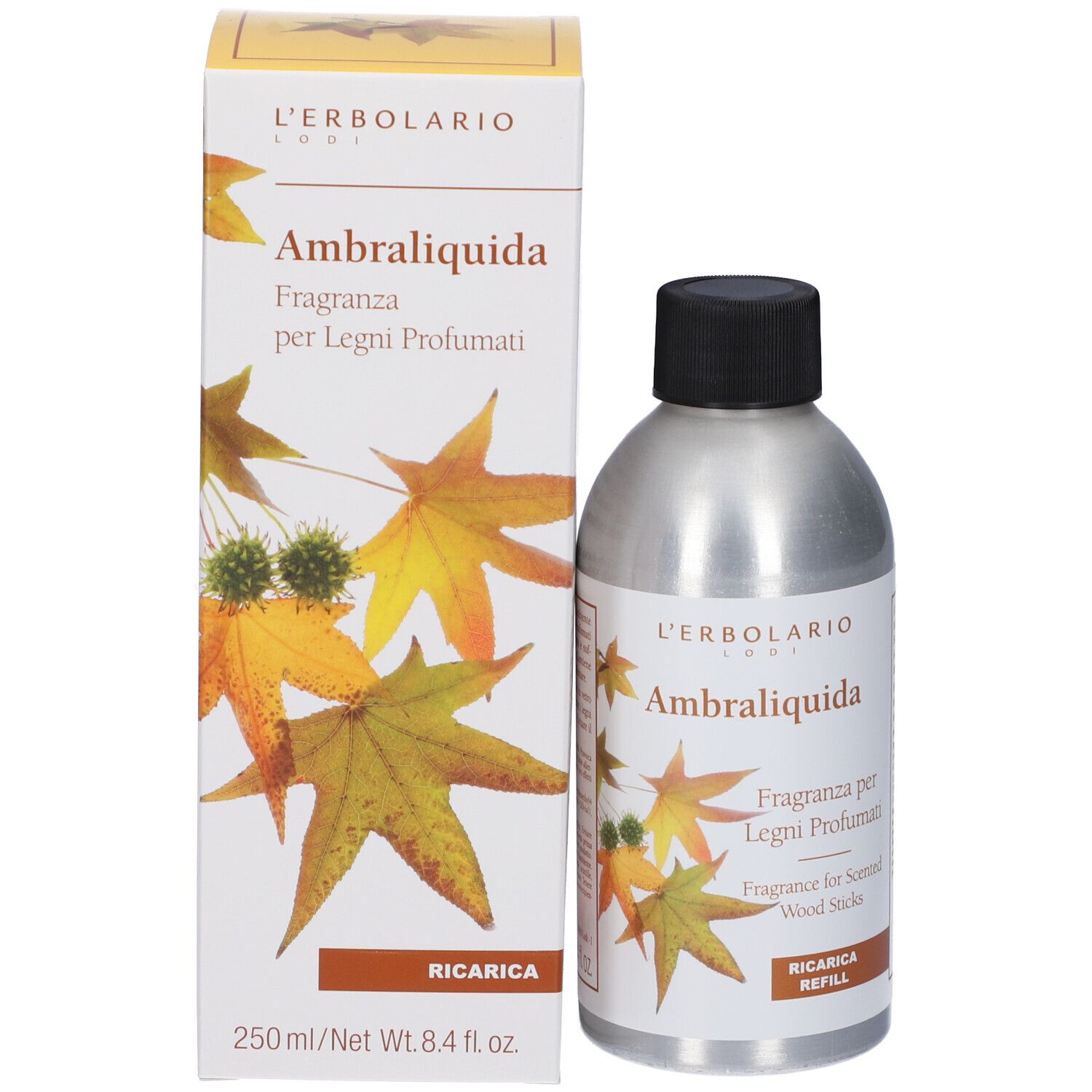 Flacone e scatola. Flacone: argento, nero, etichetta. Scatola: bianca, gialla, foglie, nome prodotto, "Ricarica".