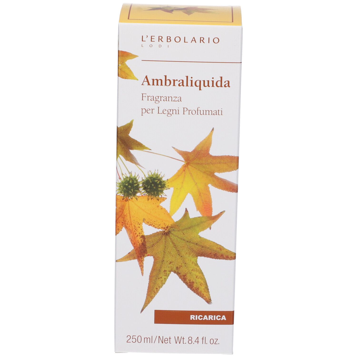 Scatola bianca con coperchio giallo. Nome prodotto Ambraliquida, foglie, "Ricarica" e testo.