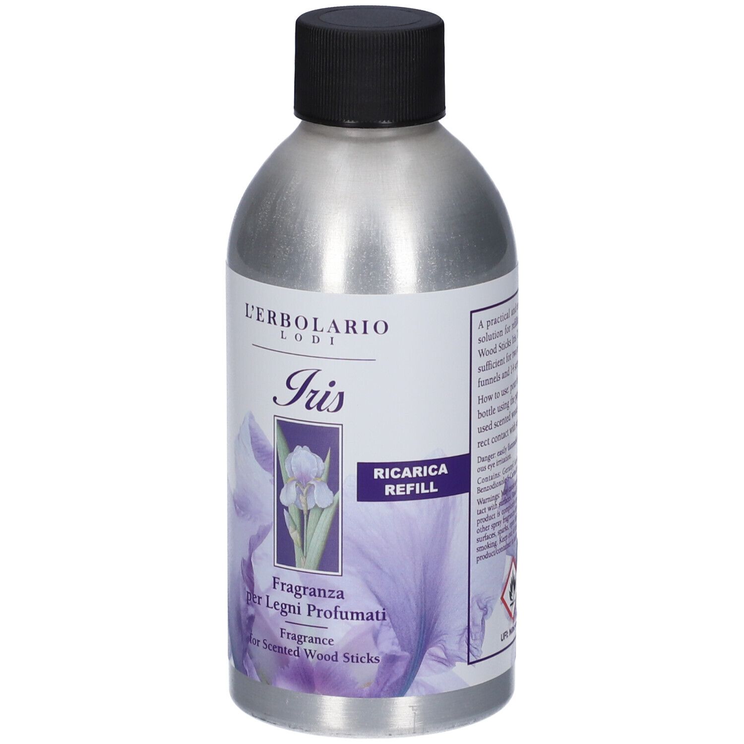 Flacone argento, tappo nero. Etichetta con motivo iris e testo: Ricarica Refill, Fragranza per Legni Profumati.
