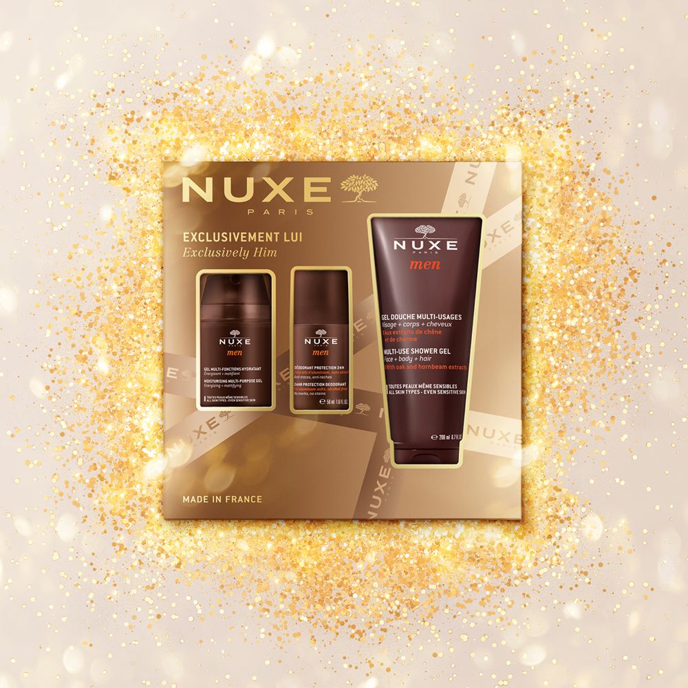 Set regalo Nuxe Men su sfondo dorato. Contiene gel doccia, deodorante e idratante. Confezione marrone con logo.