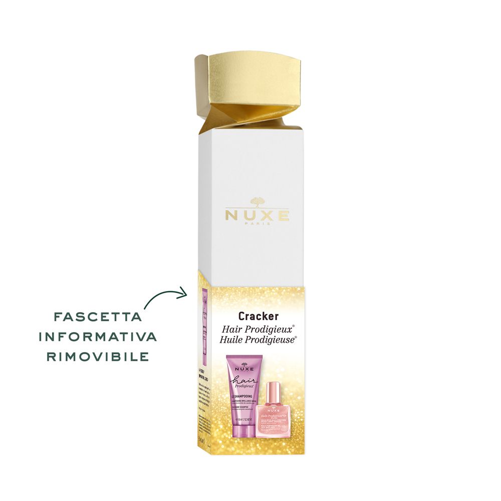 Confezione regalo con illustrazioni dei prodotti. Testo: Cracker, Hair Prodigieux, Huile Prodigieuse. Nota su un opuscolo informativo rimovibile.