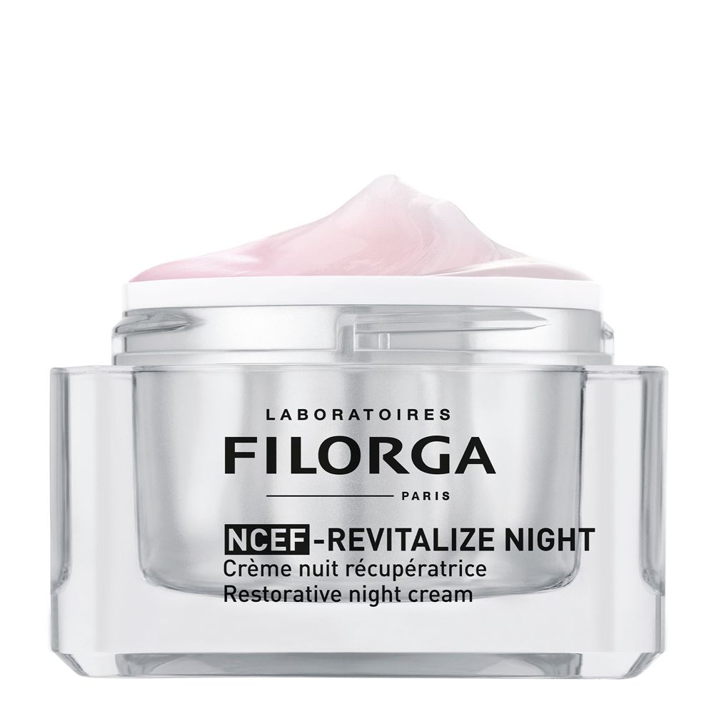 Vaso di crema con coperchio e crema rosa. Scritta: FILORGA PARIS, NCEF-REVITALIZE NIGHT, Crème nuit récupératrice, Restorative night cream.