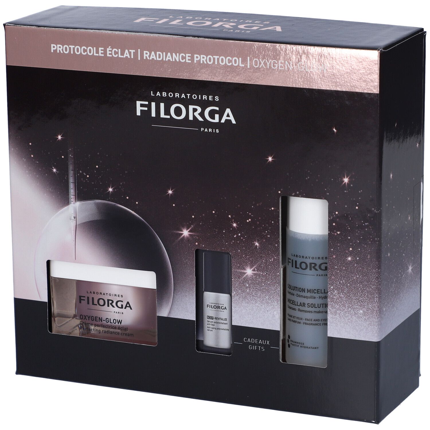 Confezione regalo cosmetica nera. Contiene creme e flaconi. Marchio Filorga. Testo: Oxygen-Glow, Radiance Protocol. Immagini di prodotti.