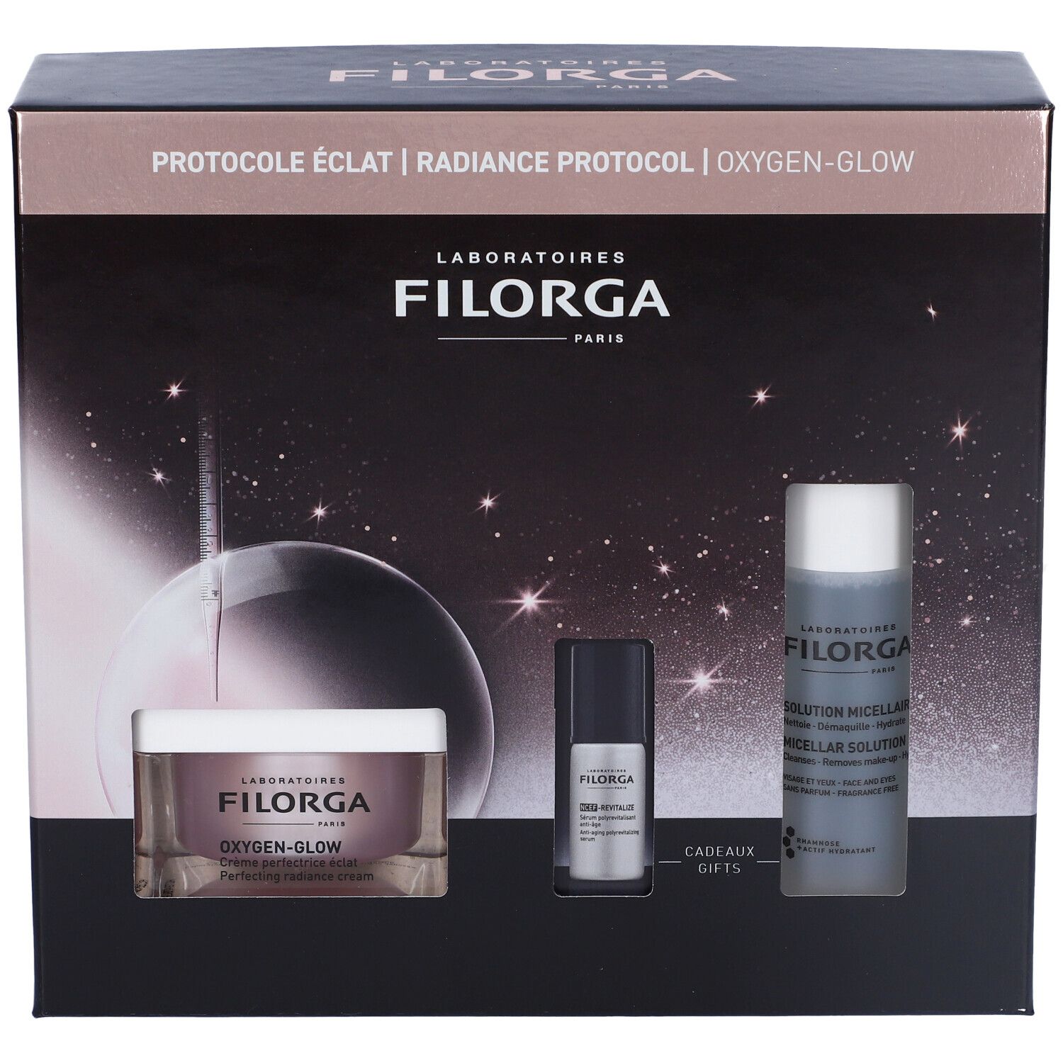 Confezione regalo cosmetica nera. Contiene creme e flaconi. Marchio Filorga. Testo: Oxygen-Glow, Radiance Protocol. Immagini di prodotti.