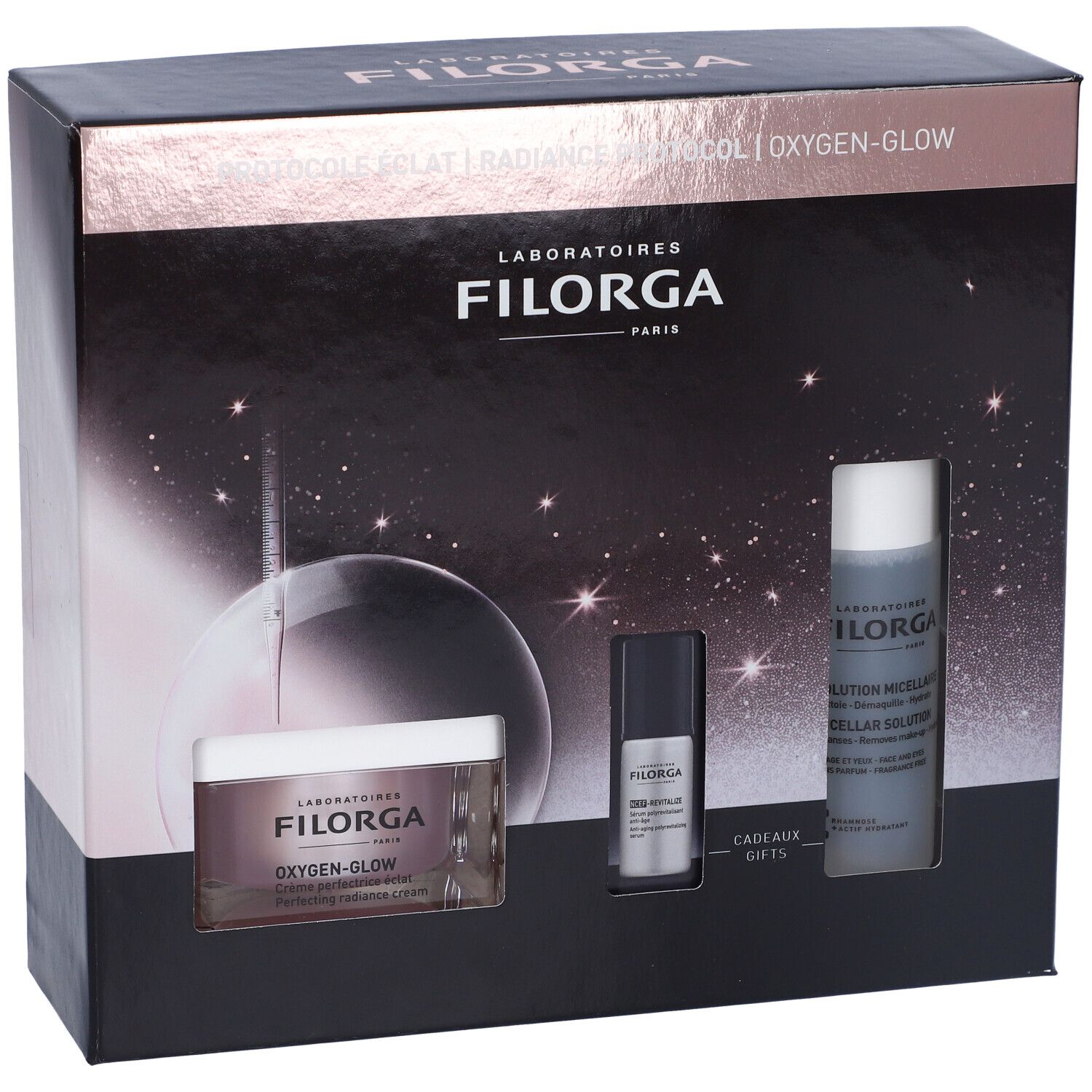 Confezione regalo cosmetica nera. Contiene creme e flaconi. Marchio Filorga. Testo: Oxygen-Glow, Radiance Protocol. Immagini di prodotti.