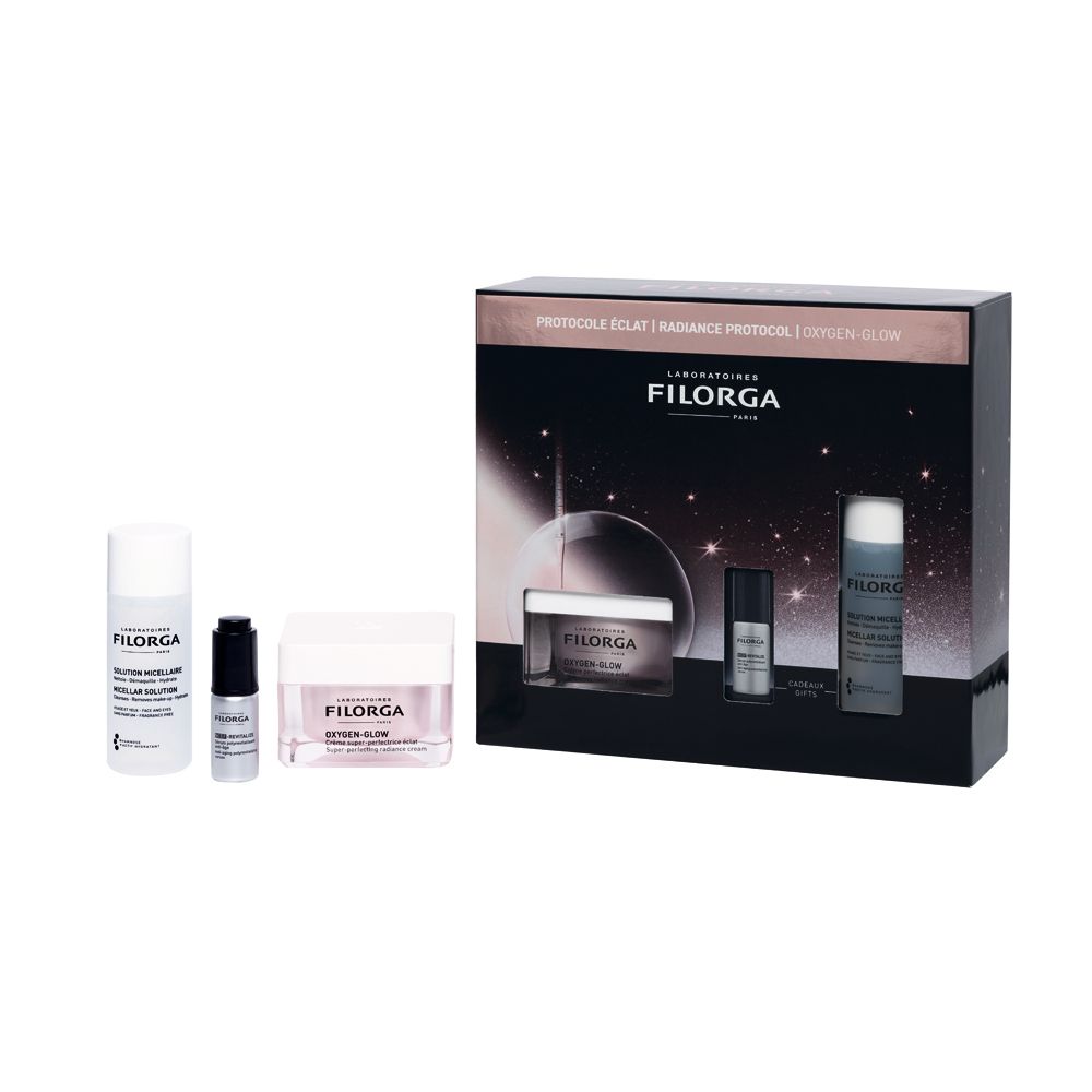 Set cosmetico con creme e flaconi. Contiene prodotti Filorga. Confezione con immagini dei prodotti. Testo: Oxygen-Glow, Radiance Protocol.