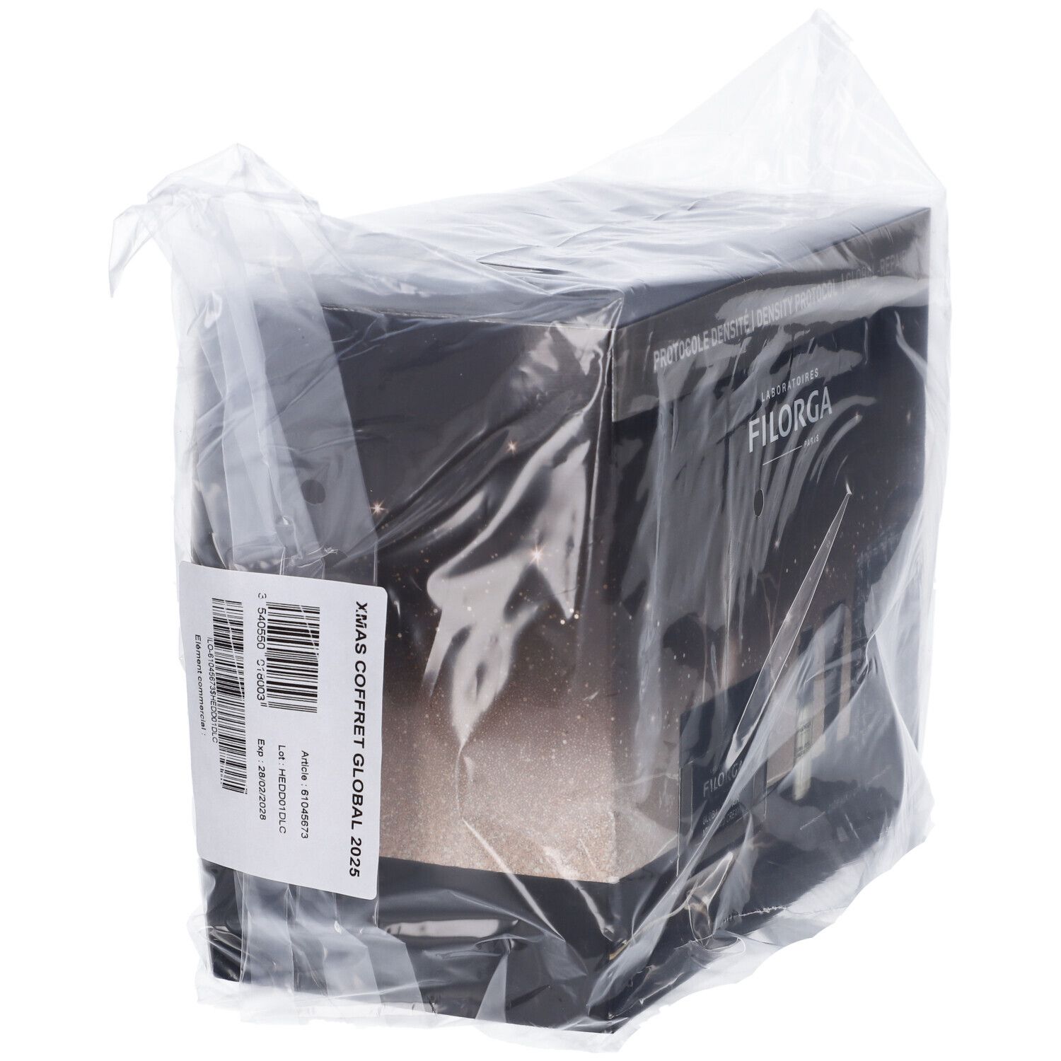 Confezione regalo in pellicola. Adesivo con codice a barre e testo. Testo: XMAS COFFRET GLOBAL 2025.