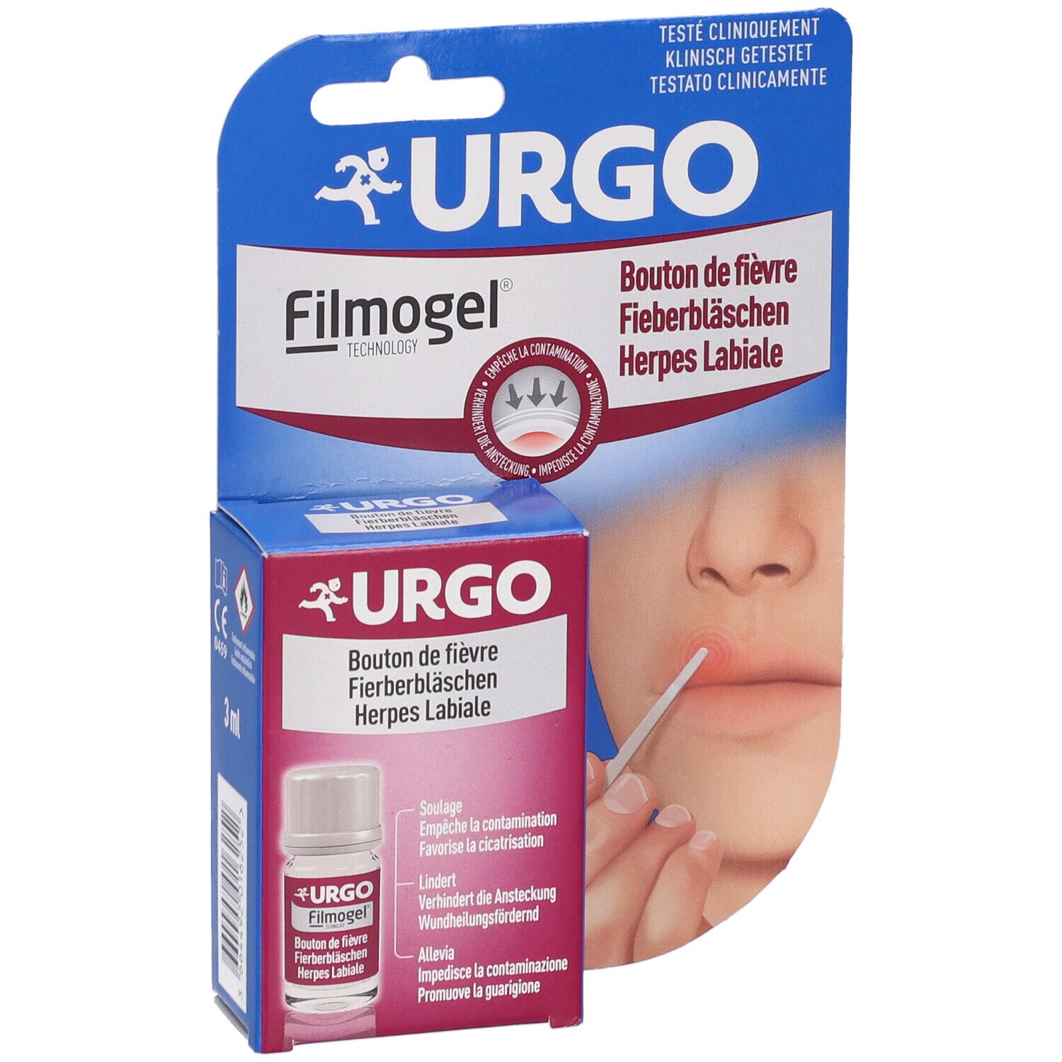 Confezione con prodotto e flacone. Scritta: URGO Filmogel. Illustrazione di bocca con herpes labiale.