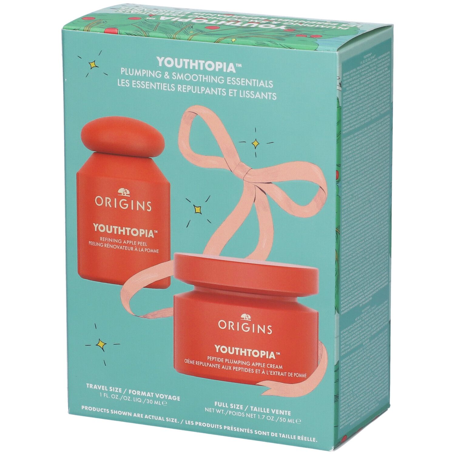 Set regalo con due vasetti rossi e fiocco. Testo: YOUTHTOPIA, peeling, crema. Formato Voyage e Full Size.