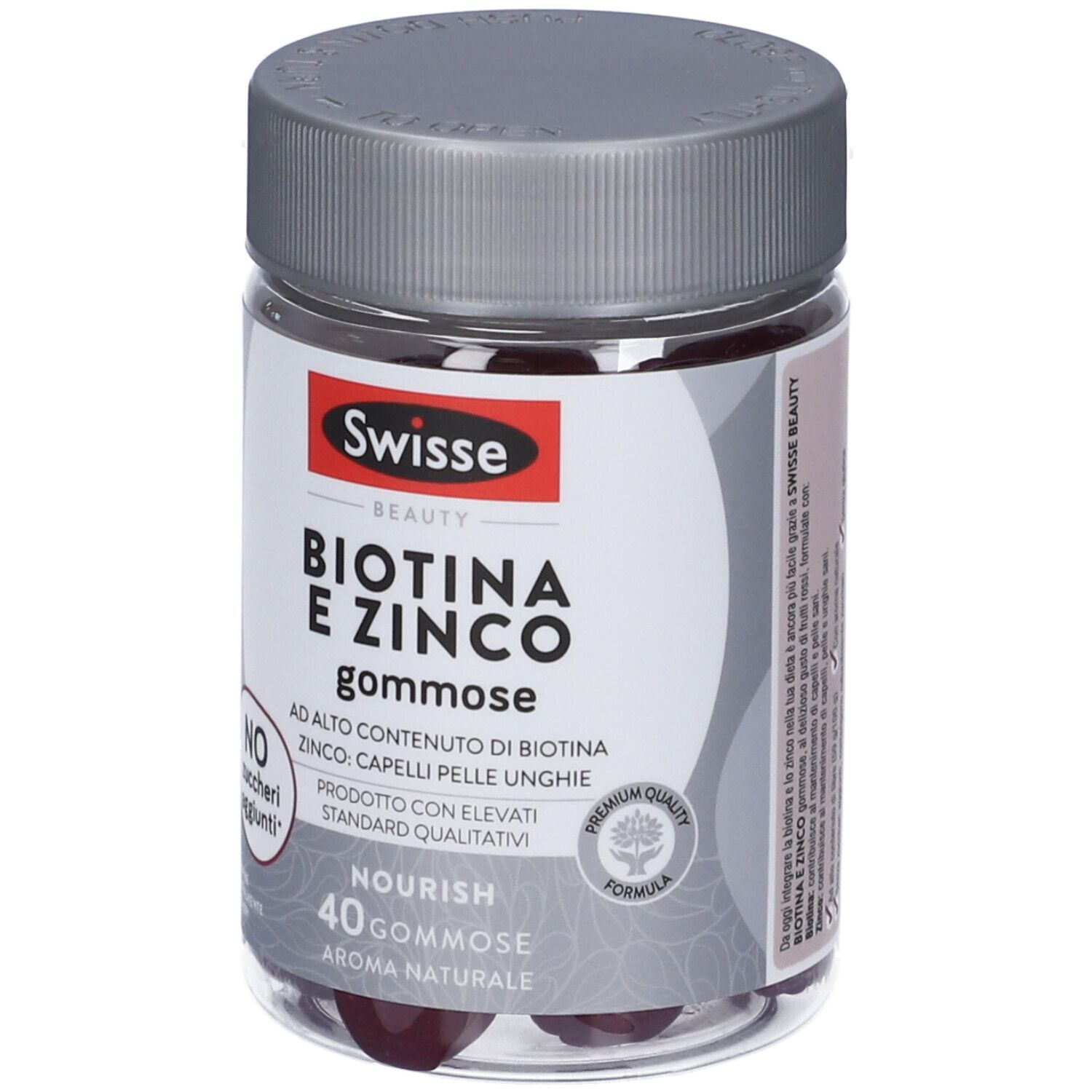Barattolo trasparente, tappo grigio. Scritta: Swisse, Biotina & Zinco, 40 caramelle gommose. Senza zuccheri aggiunti. Contiene caramelle.