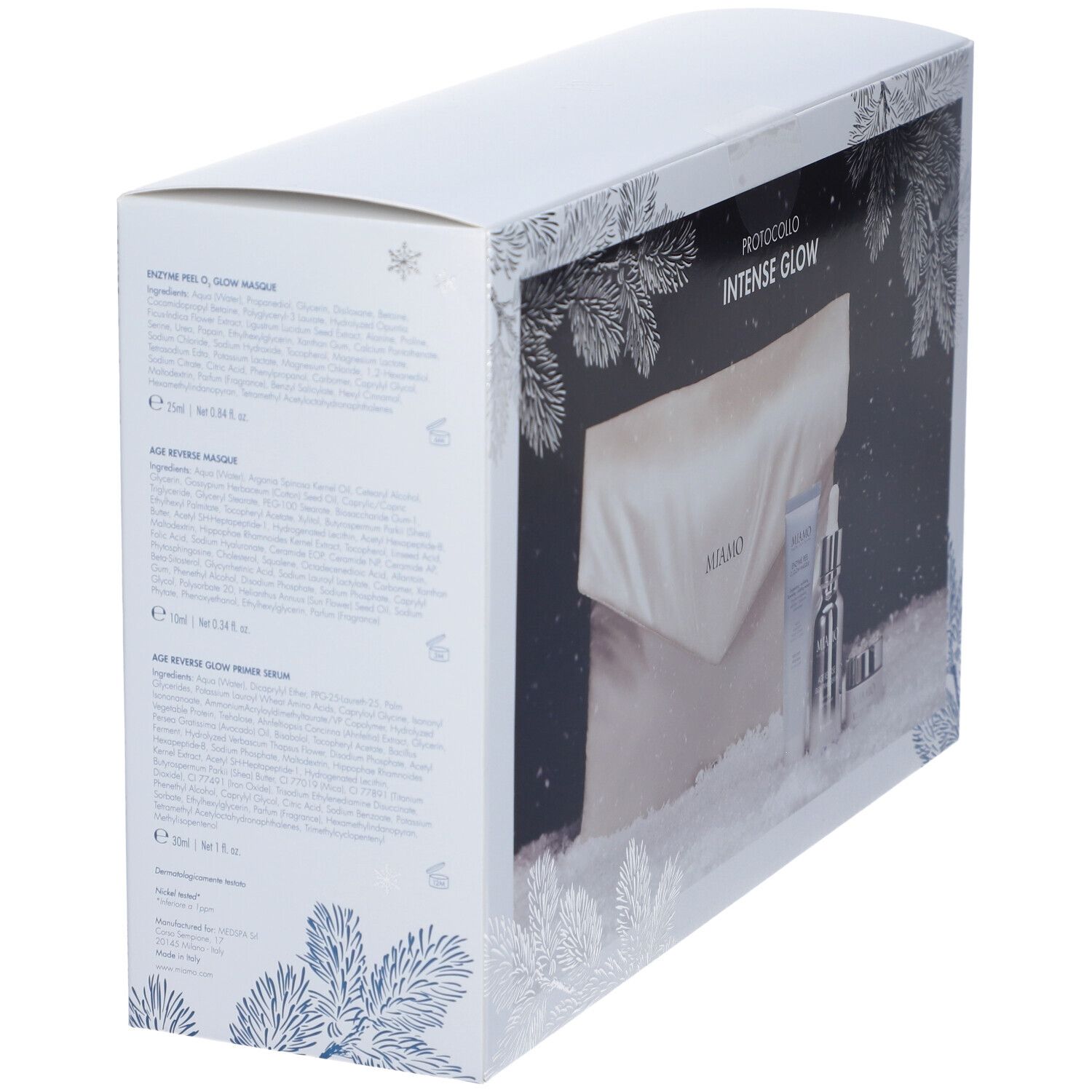 Scatola bianca con motivo rami di pino blu argento. Testo sul lato. Scritta: MIAMO PROTOCOLLO INTENSE GLOW.