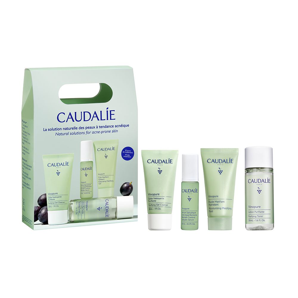 Set Caudalie con gel detergente, lozione, siero e idratante. Confezione verde con logo e testo. Uva nera.