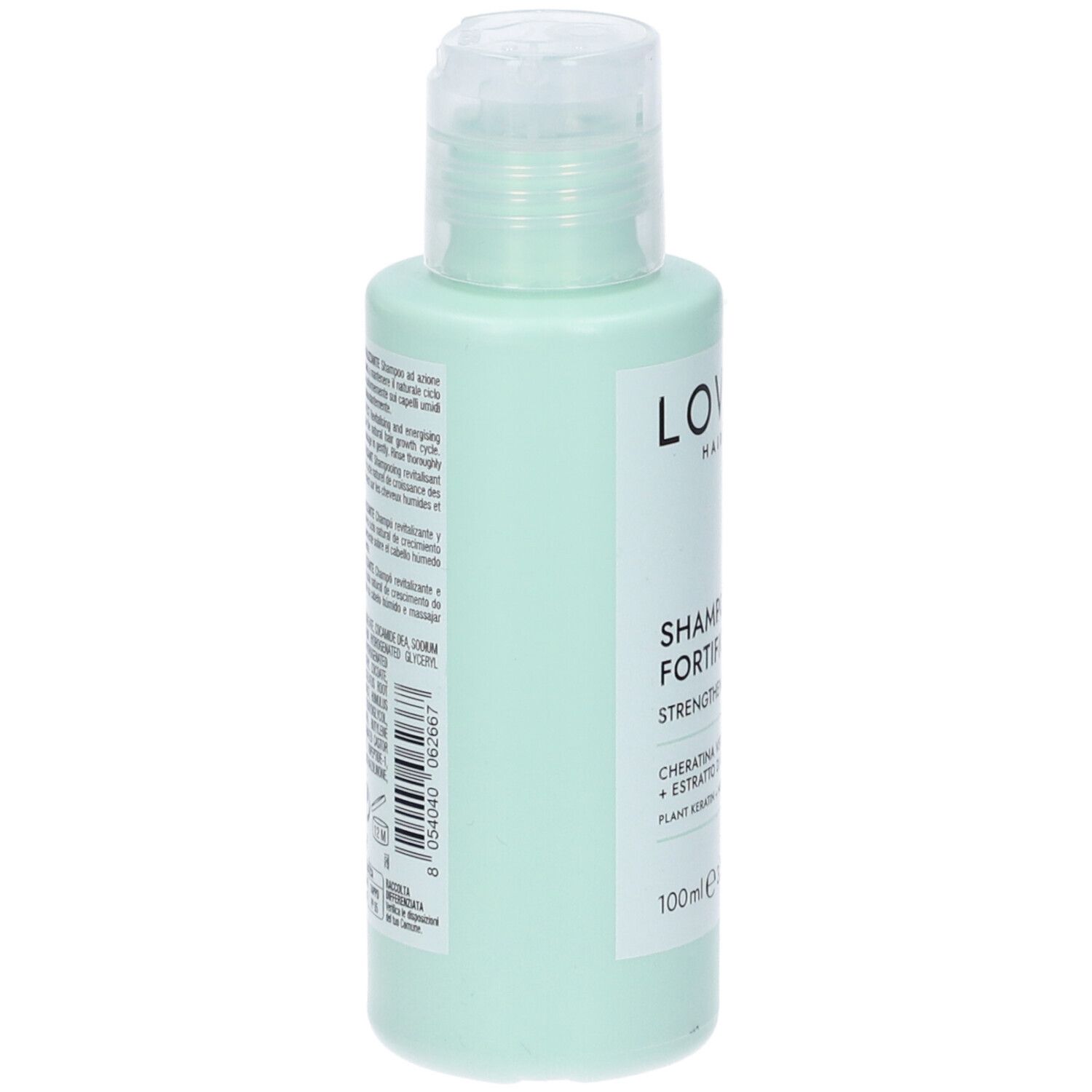 Flacone di shampoo verde chiaro, vista laterale. Etichetta bianca con testo. Tappo trasparente.