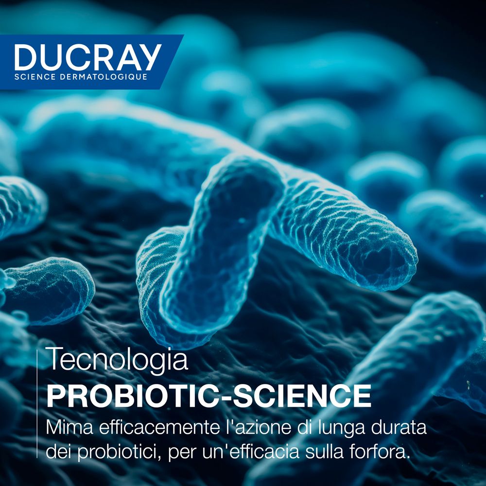 Rappresentazione microscopica di batteri. Testo: Tecnologia PROBIOTIC-SCIENCE. Agisce efficacemente sull'azione a lungo termine dei probiotici. Marchio: DUCRAY.