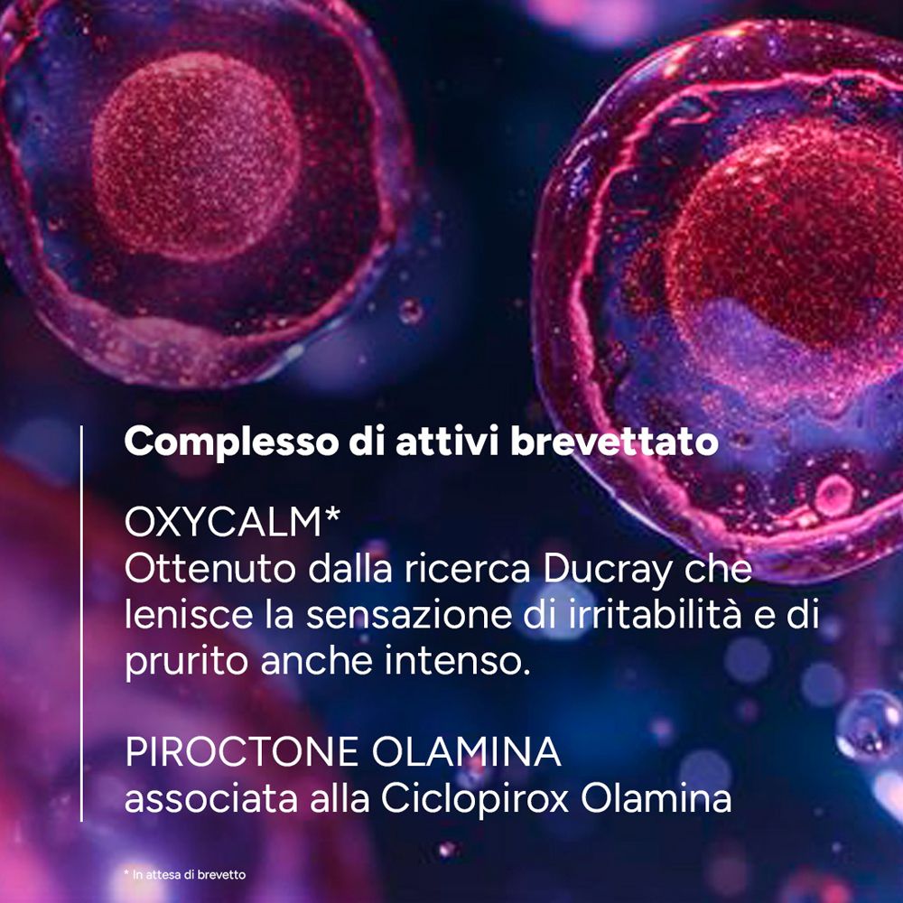 Primo piano di cellule. Testo: OXYCALM, Piroctone Olamina, associata a Ciclopirox Olamina.