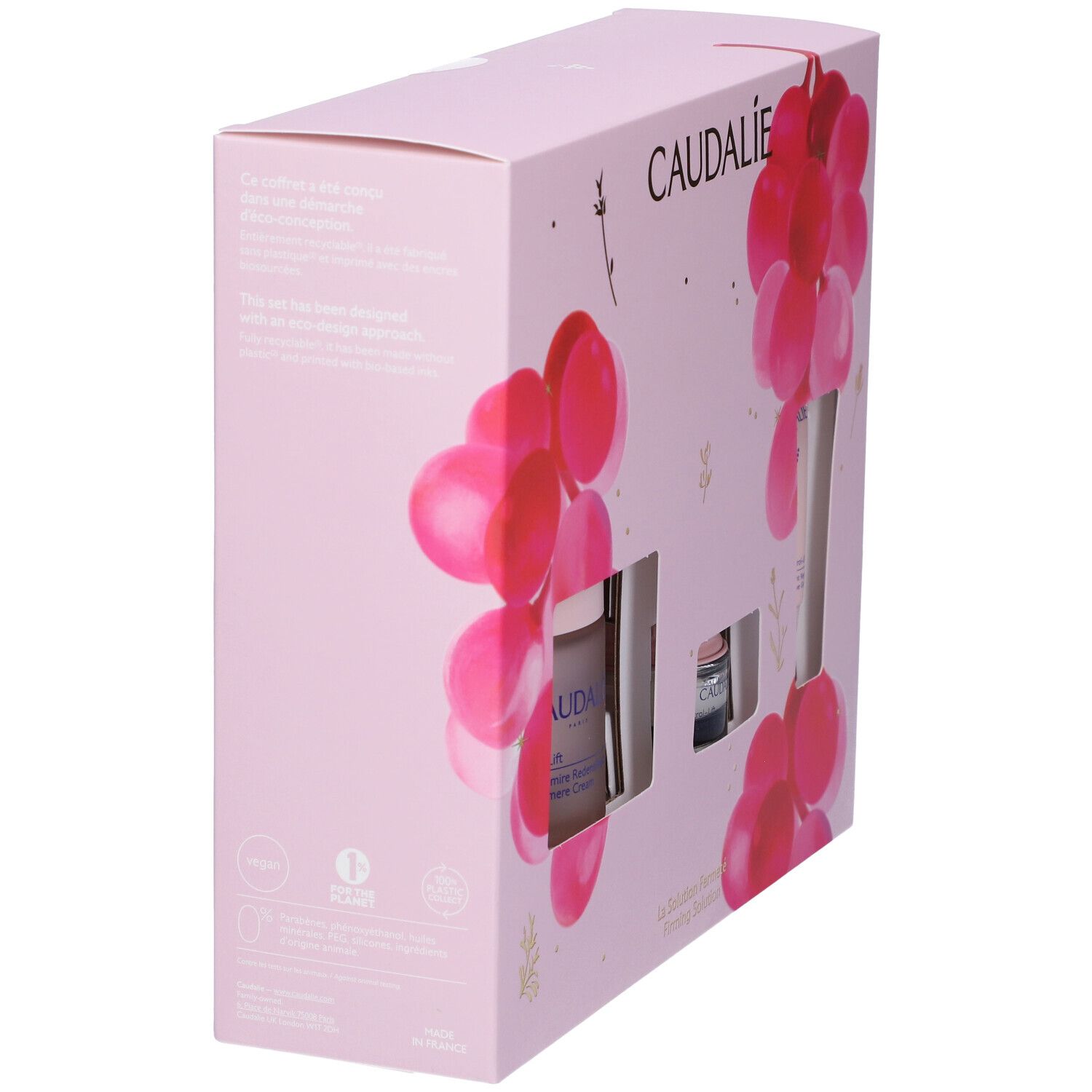 Confezione regalo rosa, vista laterale. Logo Caudalie in alto. Decorata con grappoli rosa. Testo laterale.