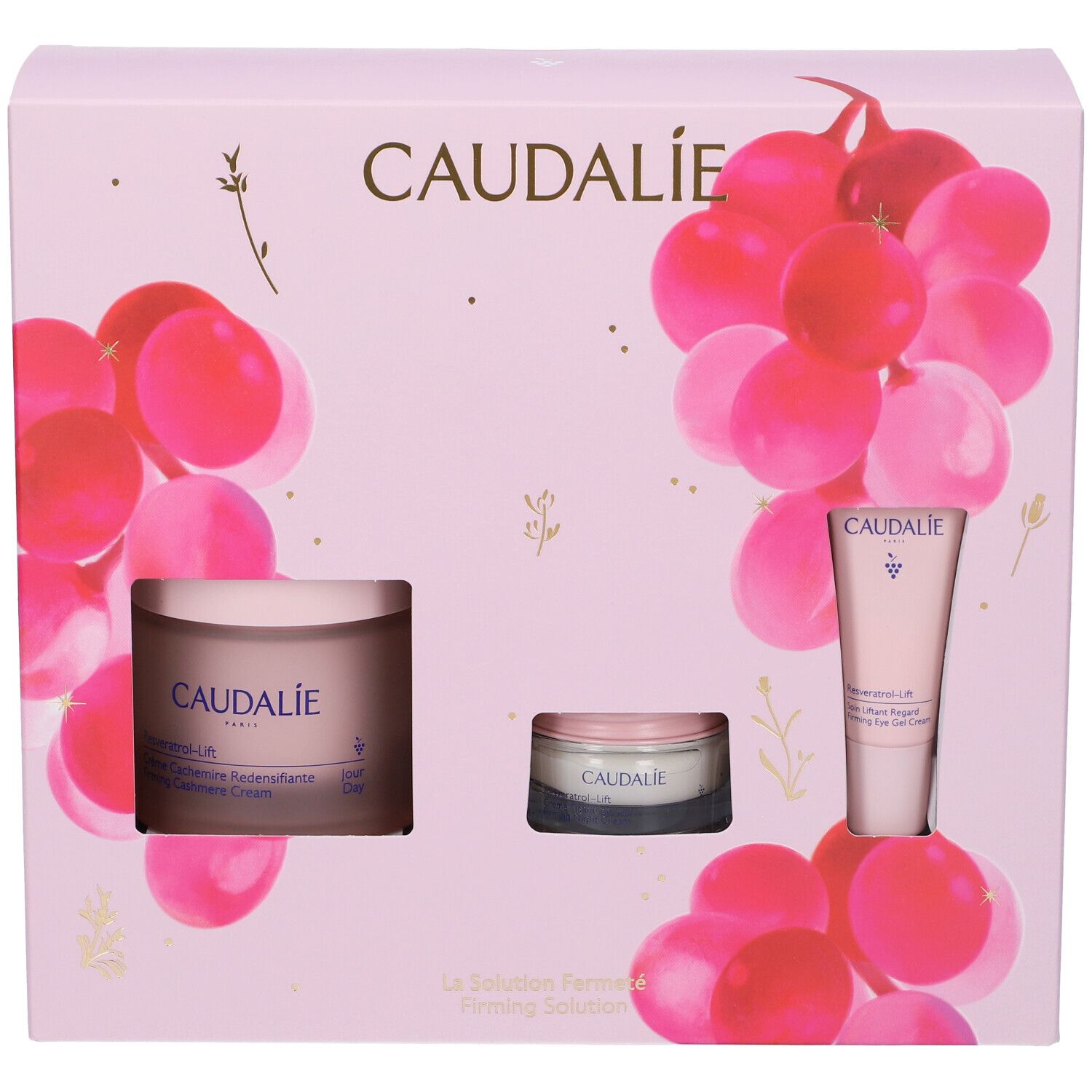 Confezione regalo rosa Caudalie. Contiene creme e tubi. Decorata con grappoli d'uva rosa.