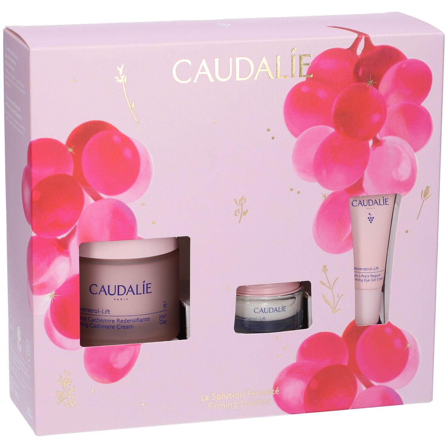 Confezione regalo rosa Caudalie. Contiene creme e tubi. Decorata con grappoli d'uva rosa.