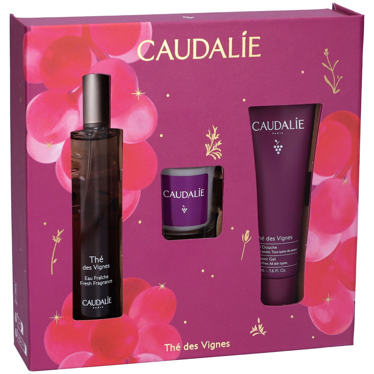 Set regalo con flacone, candela e tubo. Confezione viola con motivo floreale. Logo Caudalie.