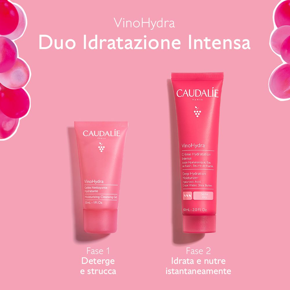 Due tubi rosa Caudalie VinoHydra. Scritte: Fase 1, Fase 2. Sfondo rosa con uva.