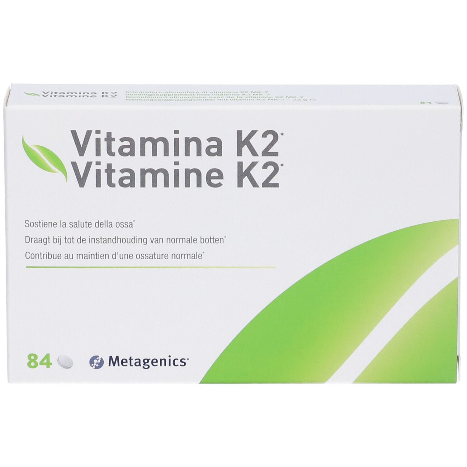 Scatola bianca con dettagli verdi. Scritta: Vitamina K2, Vitamine K2. Contiene 84 compresse. Marchio: Metagenics.