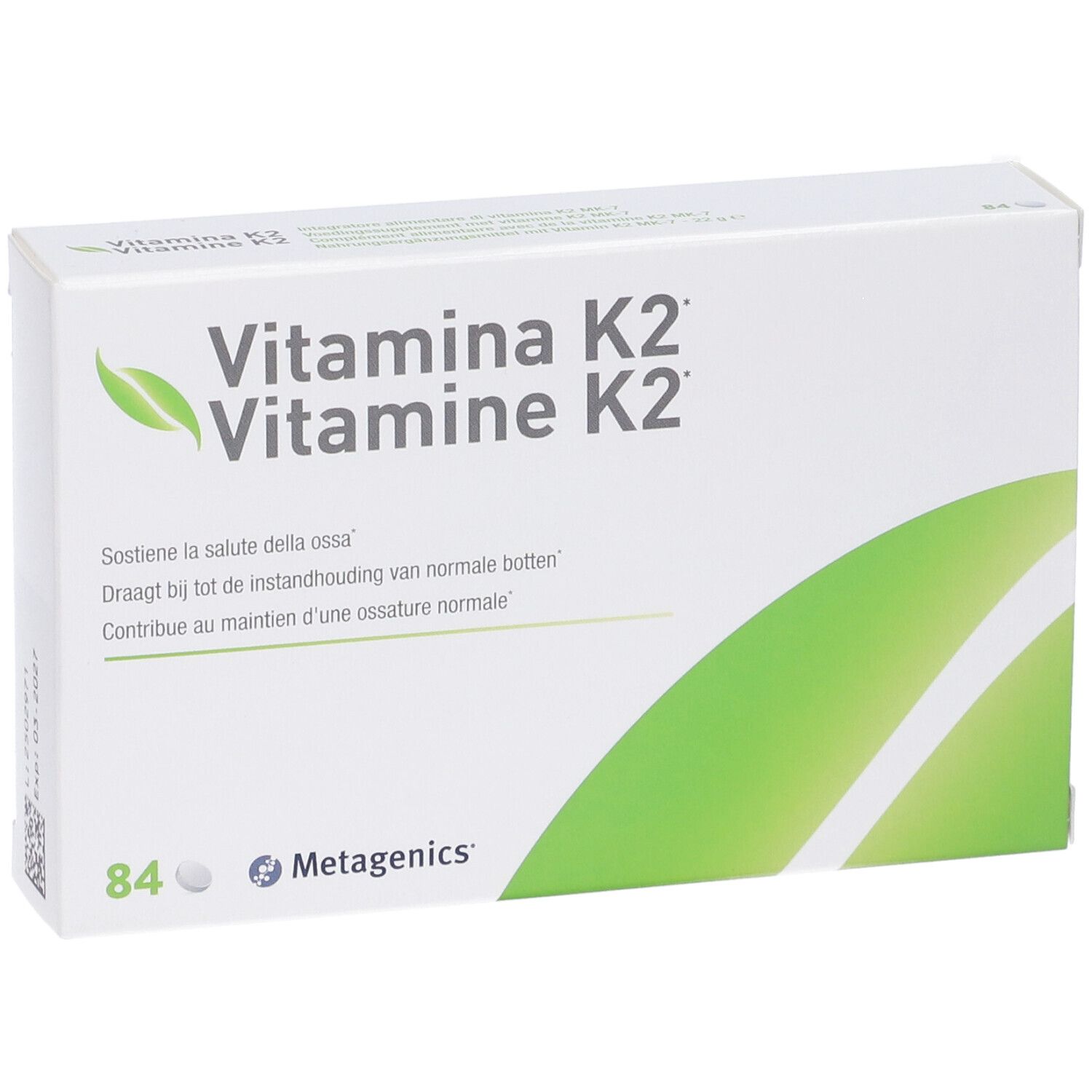 Scatola bianca con dettagli verdi. Scritta: Vitamina K2, Vitamine K2. Contiene 84 compresse. Marchio: Metagenics.