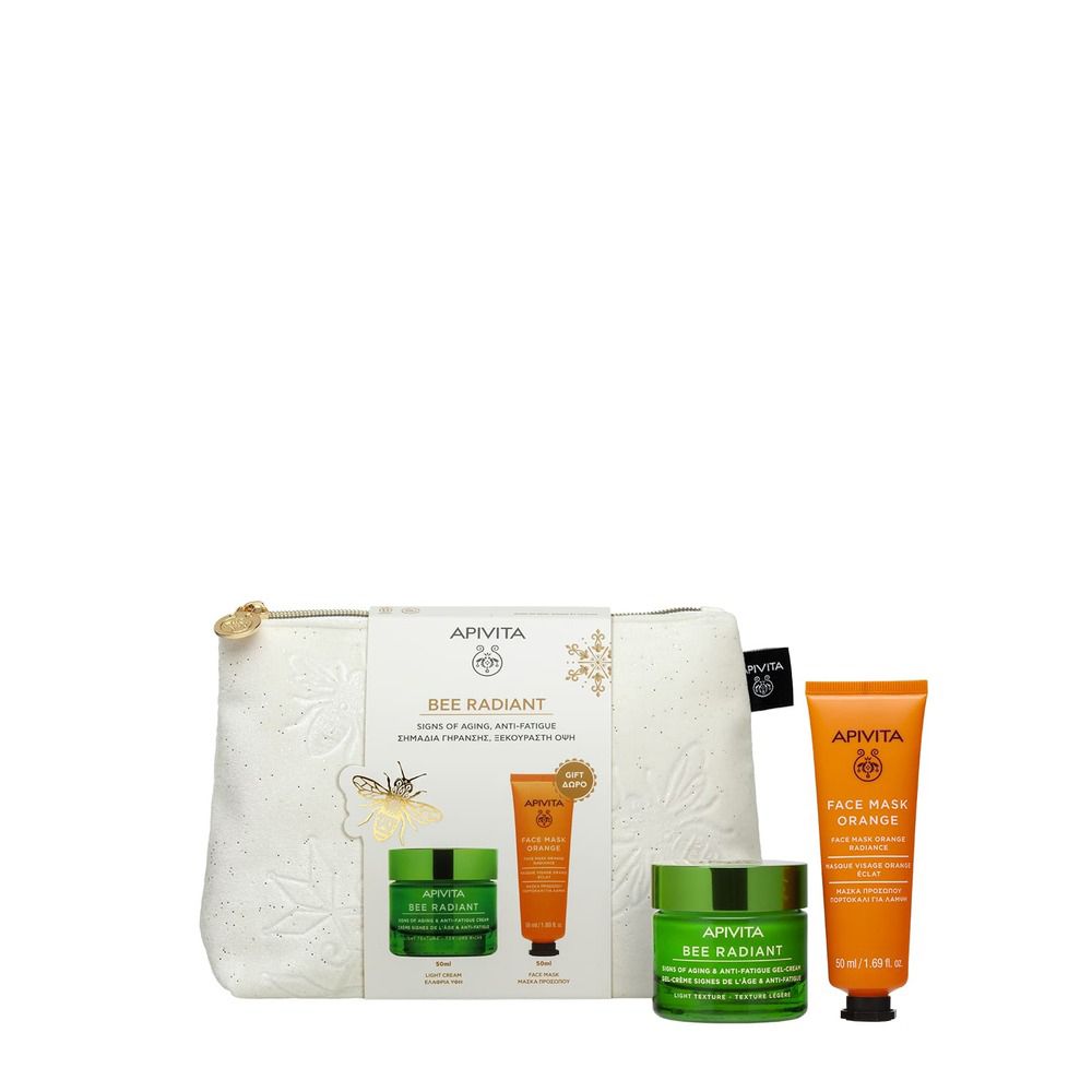 Set regalo cosmetico. Include un beauty case bianco, due vasetti di crema verdi, un tubetto arancione e una maschera viso arancione.