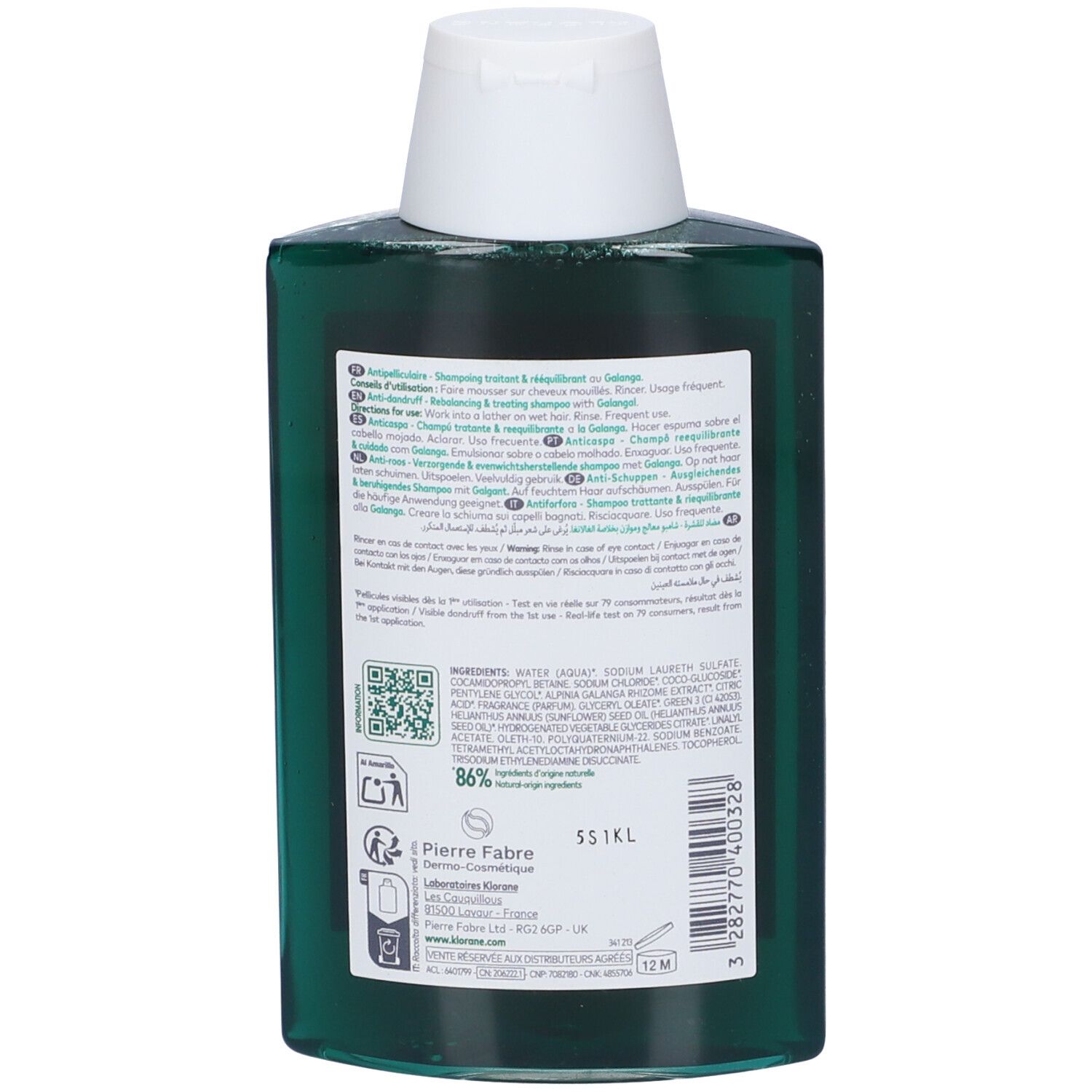 Retro del flacone verde di shampoo Klorane. Tappo bianco. Etichetta con informazioni sul prodotto e ingredienti.