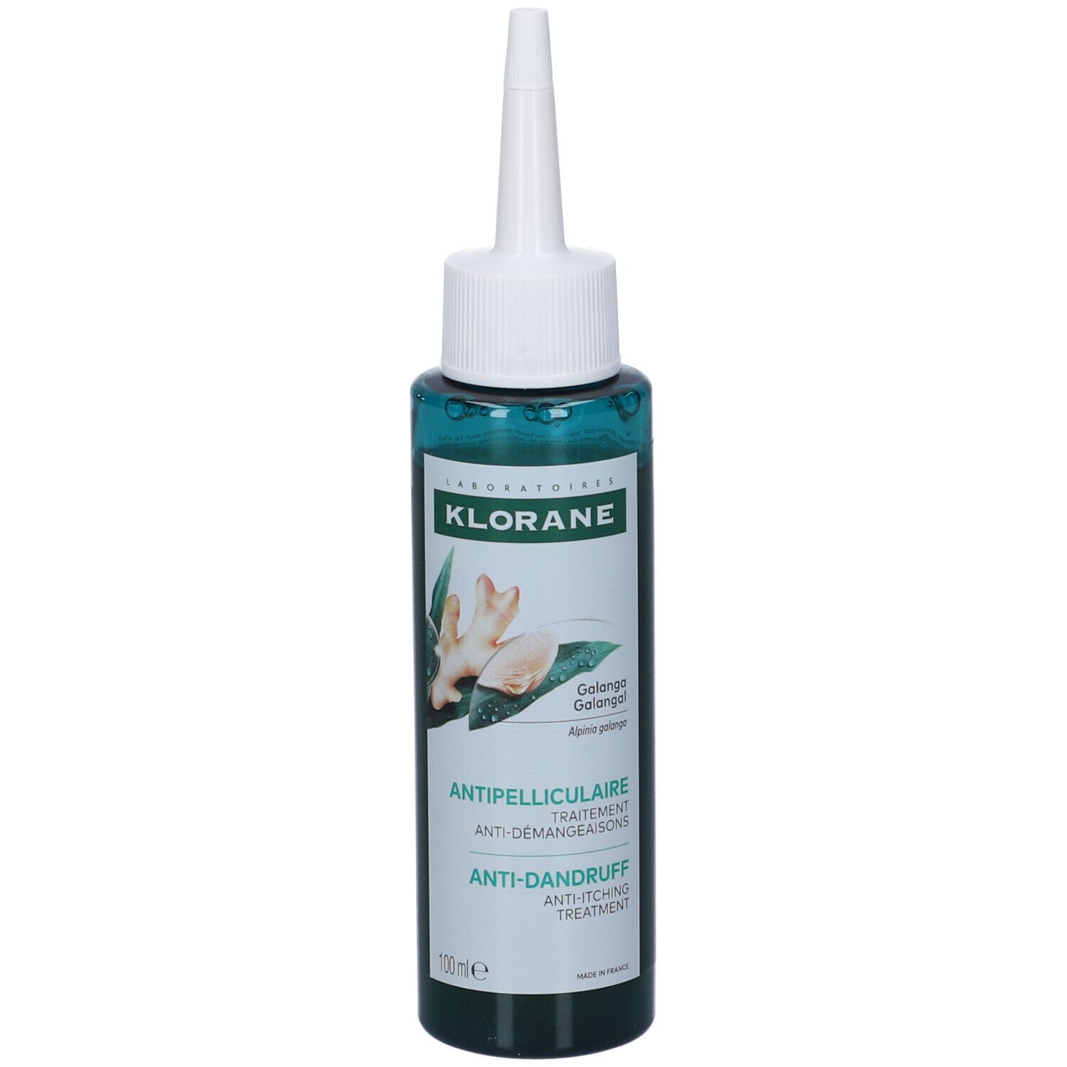Flacone verde con applicatore bianco. Scritta: Klorane, trattamento antiforfora. Immagine di zenzero.