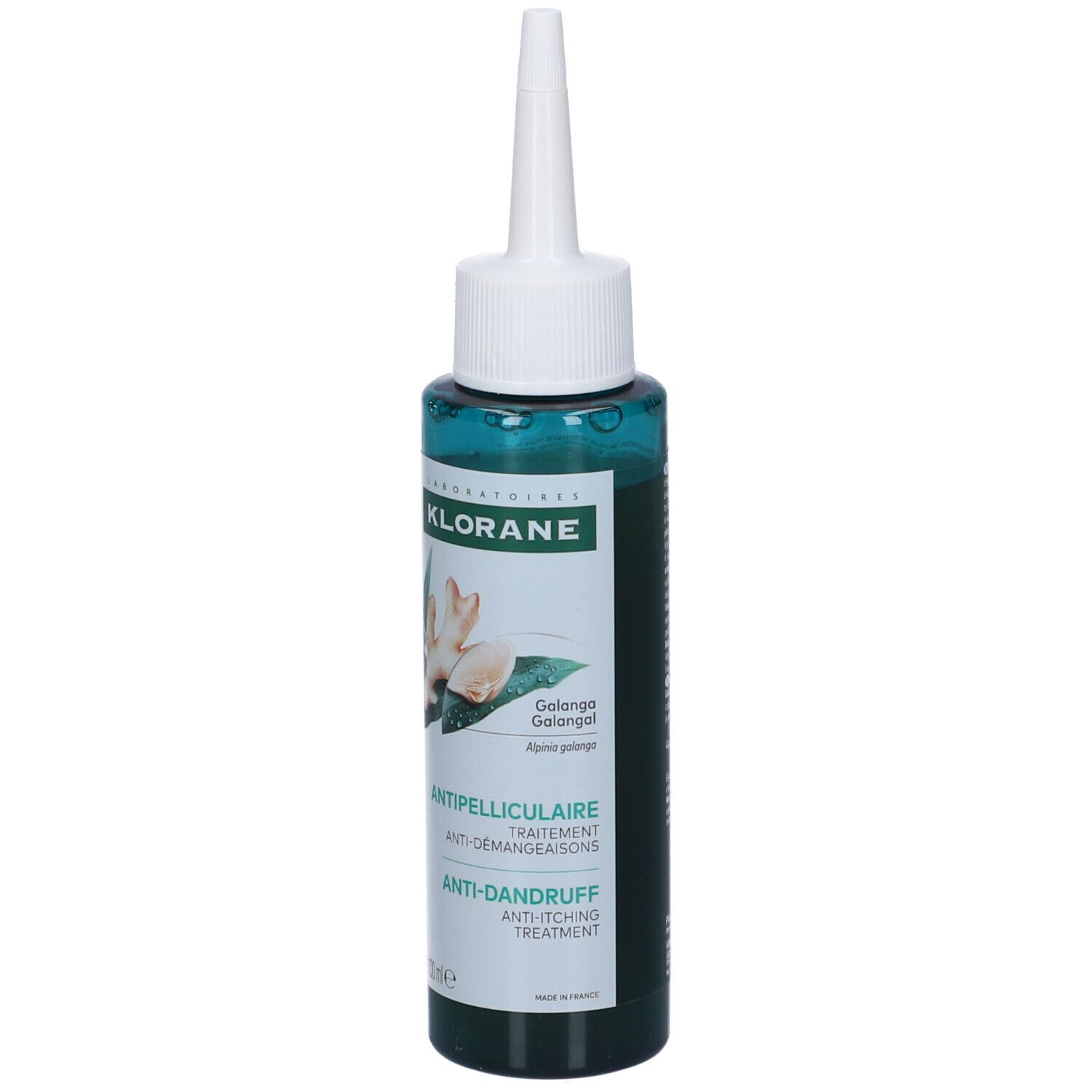Flacone verde con applicatore bianco. Scritta: Klorane, trattamento antiforfora. Immagine di zenzero.