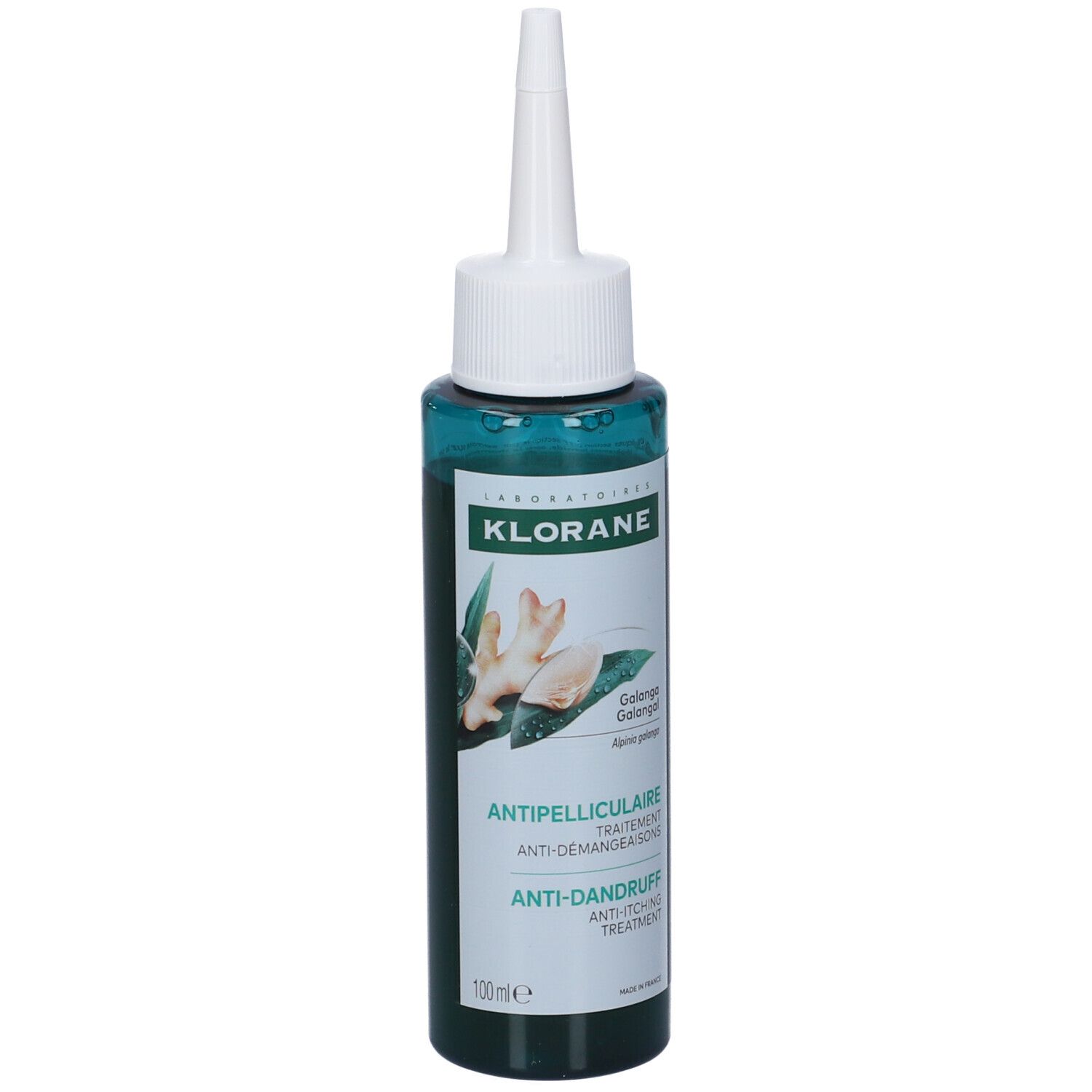 Flacone verde con applicatore bianco. Scritta: Klorane, trattamento antiforfora. Immagine di zenzero.