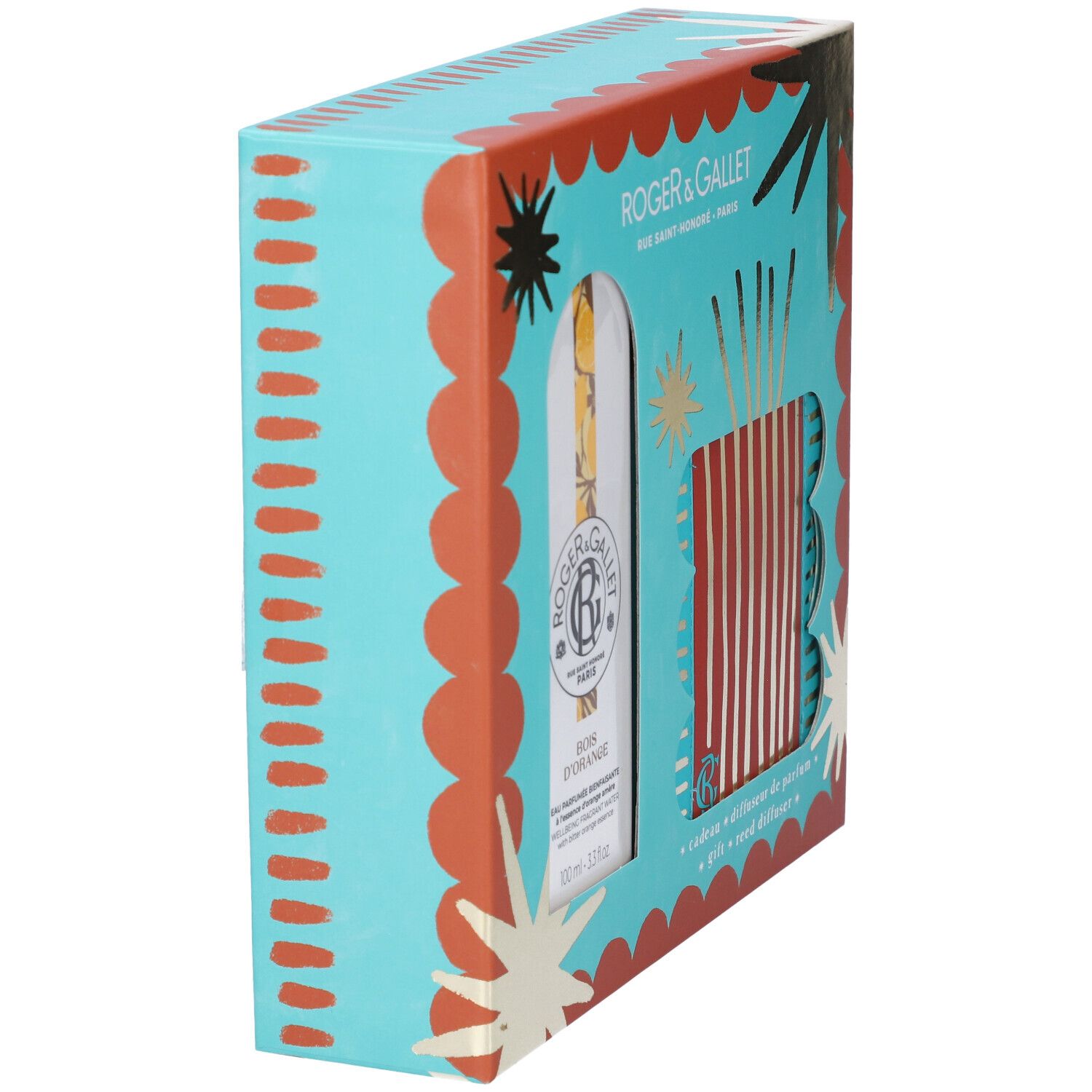 Vista laterale del set regalo. Confezione turchese e arancione con dettagli dorati. Contiene flacone e diffusore.