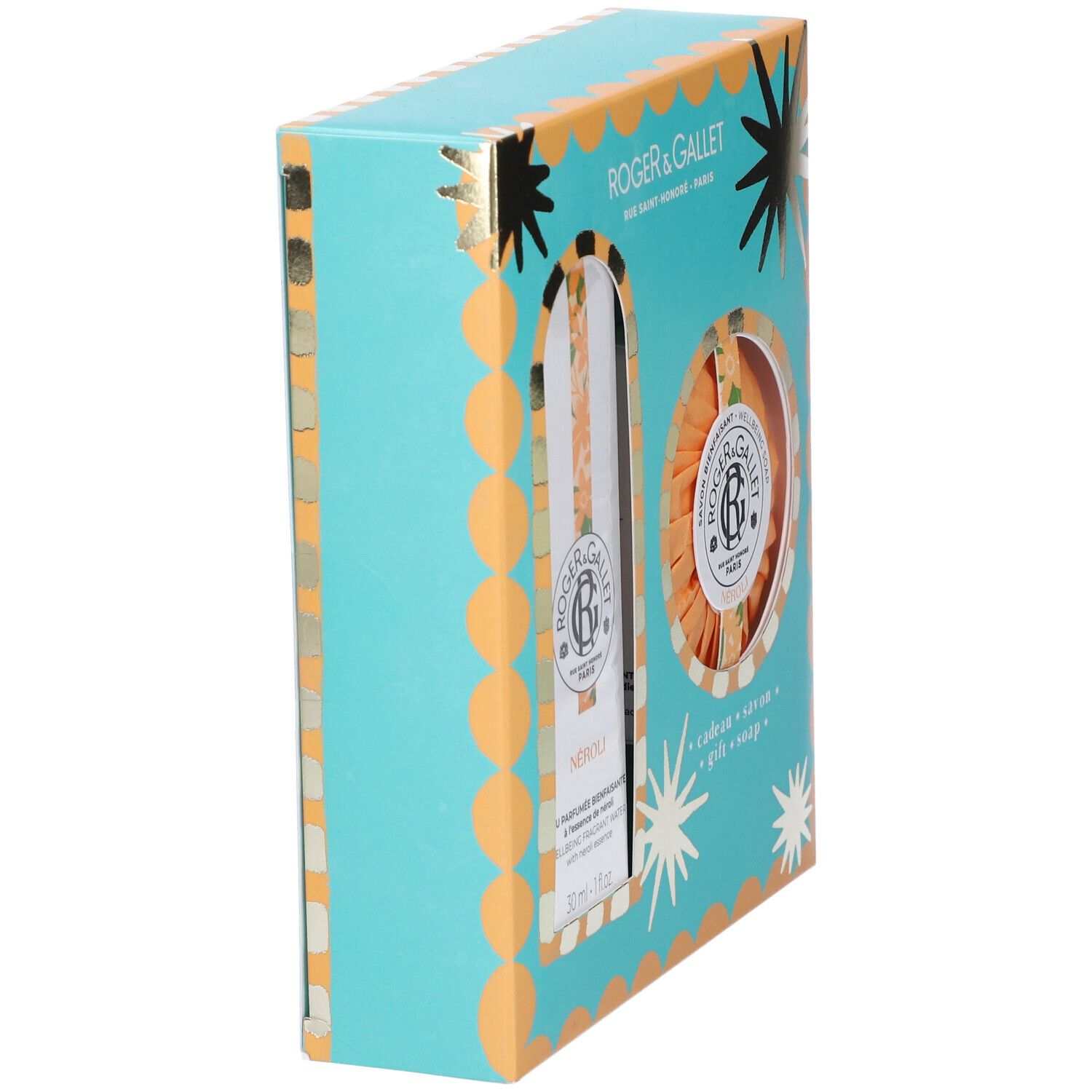 Scatola regalo turchese-arancione con stelle e nomi dei prodotti. Contiene una bottiglia e un sapone rotondo. Vista laterale della confezione.