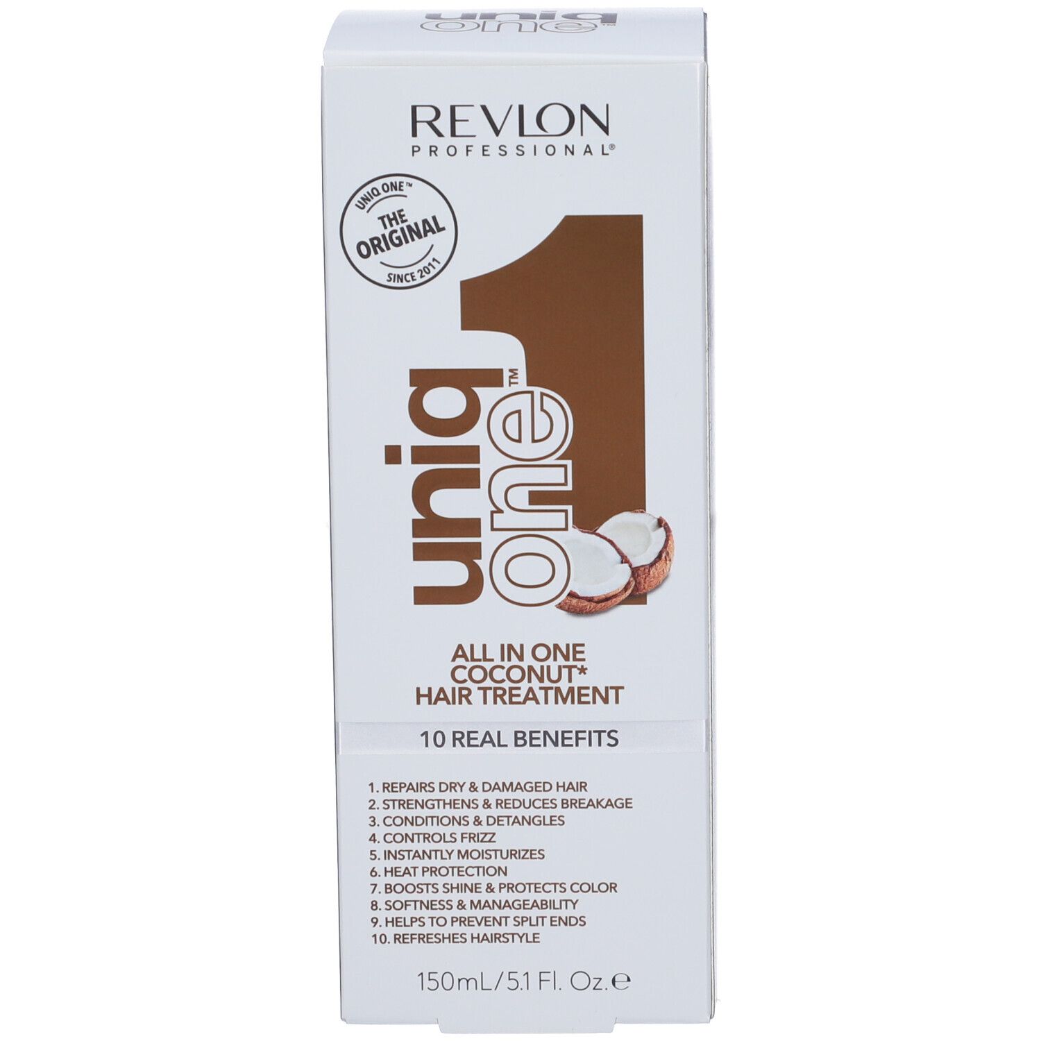 Spray per trattamento capelli e confezione. Flacone bianco e scatola. Scritta: Revlon, Uniq One, Coconut Hair Treatment.