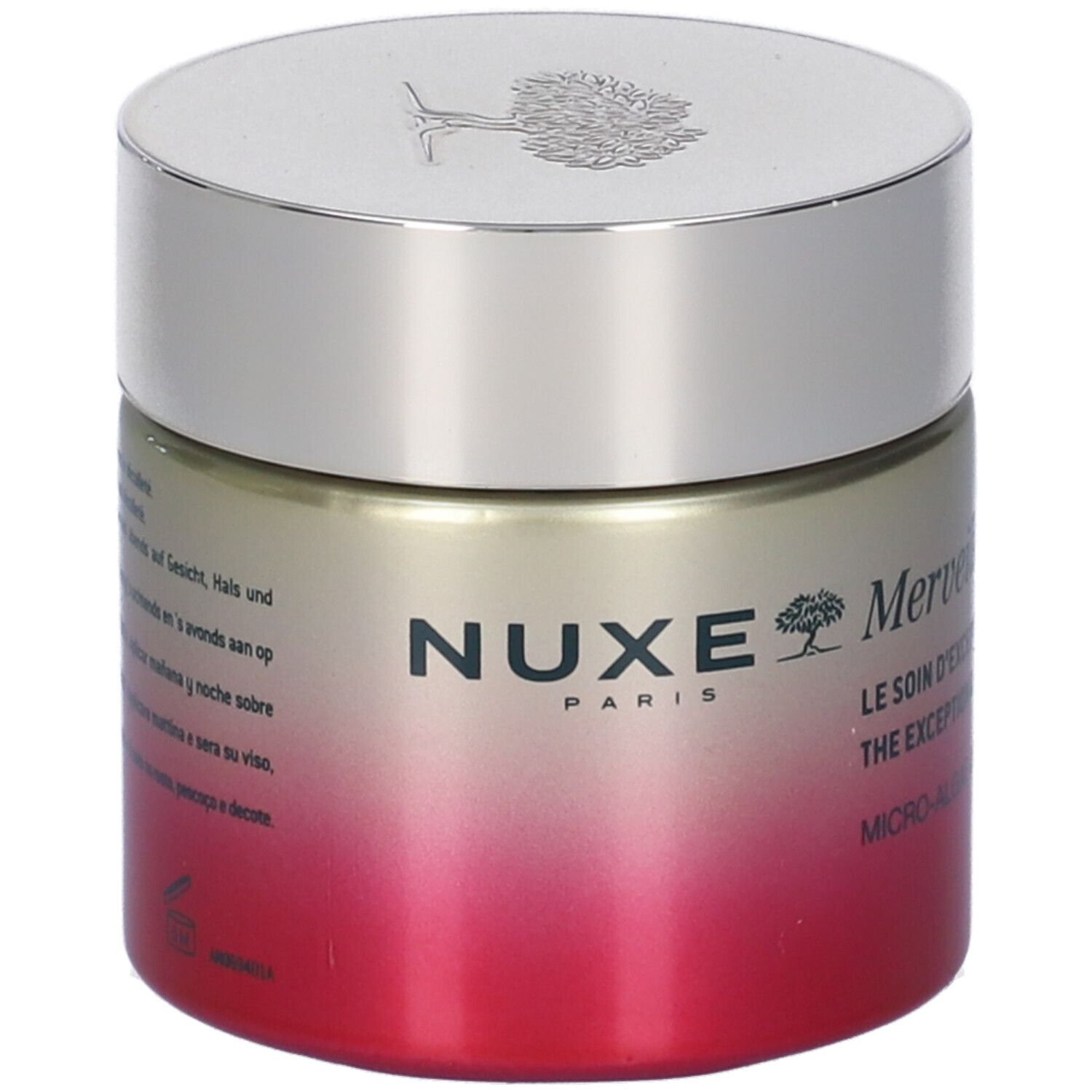 Vaso di crema con coperchio argentato. Scritta: Nuxe. Testo in più lingue.