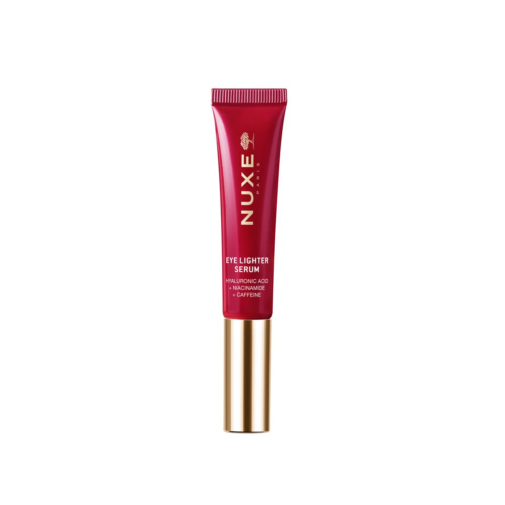 Tubo rosso con tappo dorato. Scritta: Nuxe Paris, Eye Lighter Serum. Contiene acido ialuronico, niacinamide, caffeina.