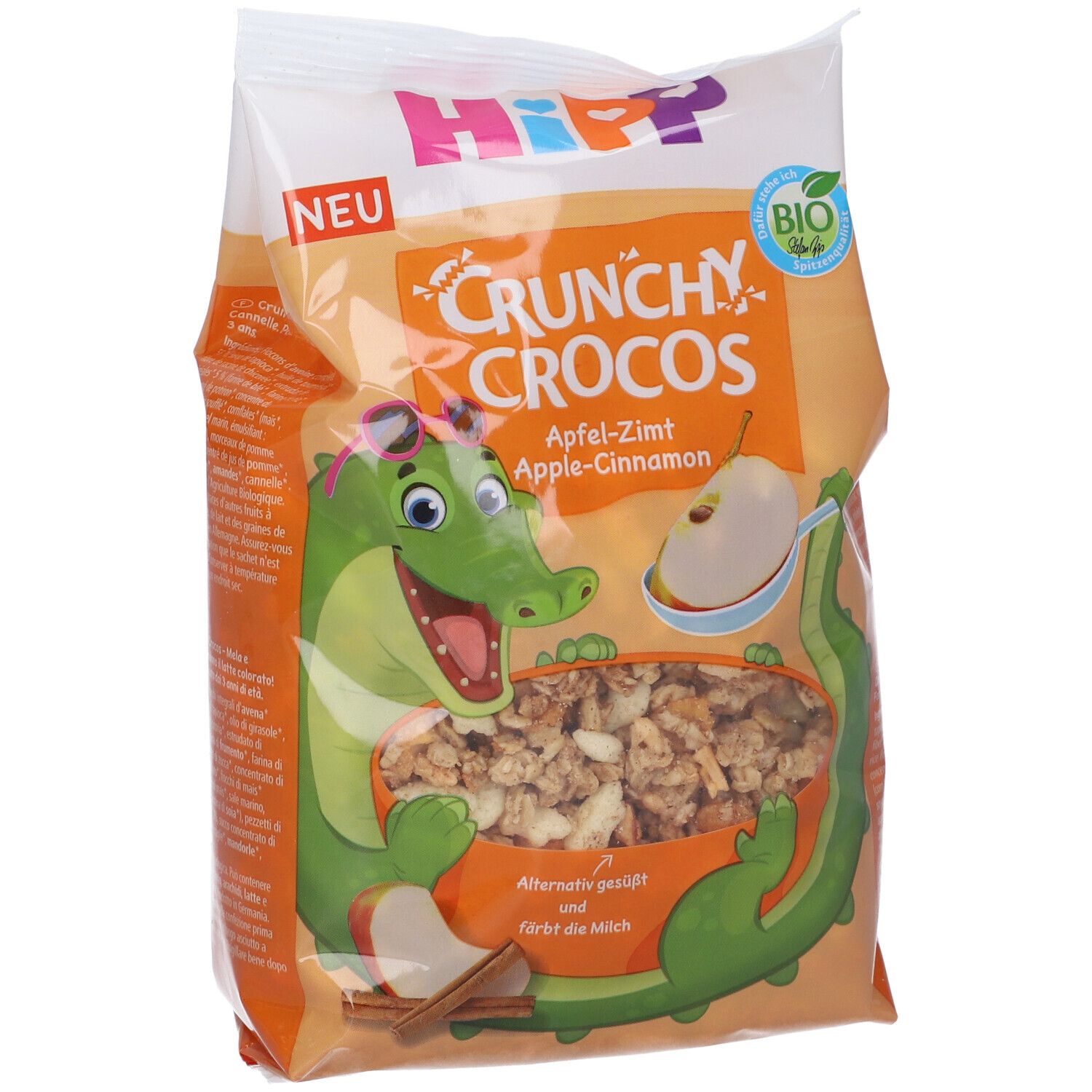 Confezione di Hipp Crunchy Crocos Mela & Cannella. Illustrazione di un coccodrillo con occhiali. Sigillo biologico. Scritta: Crunchy Crocos Mela-Cannella.