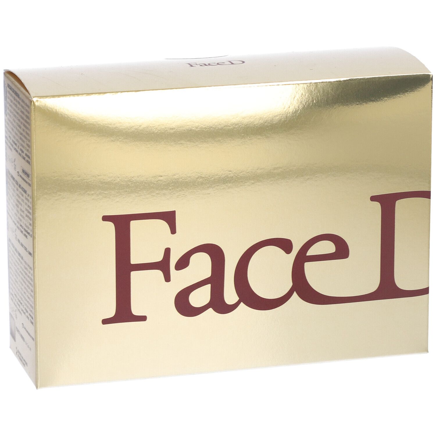 Scatola dorata con scritta rossa Face D. Superficie lucida. Confezione del prodotto.