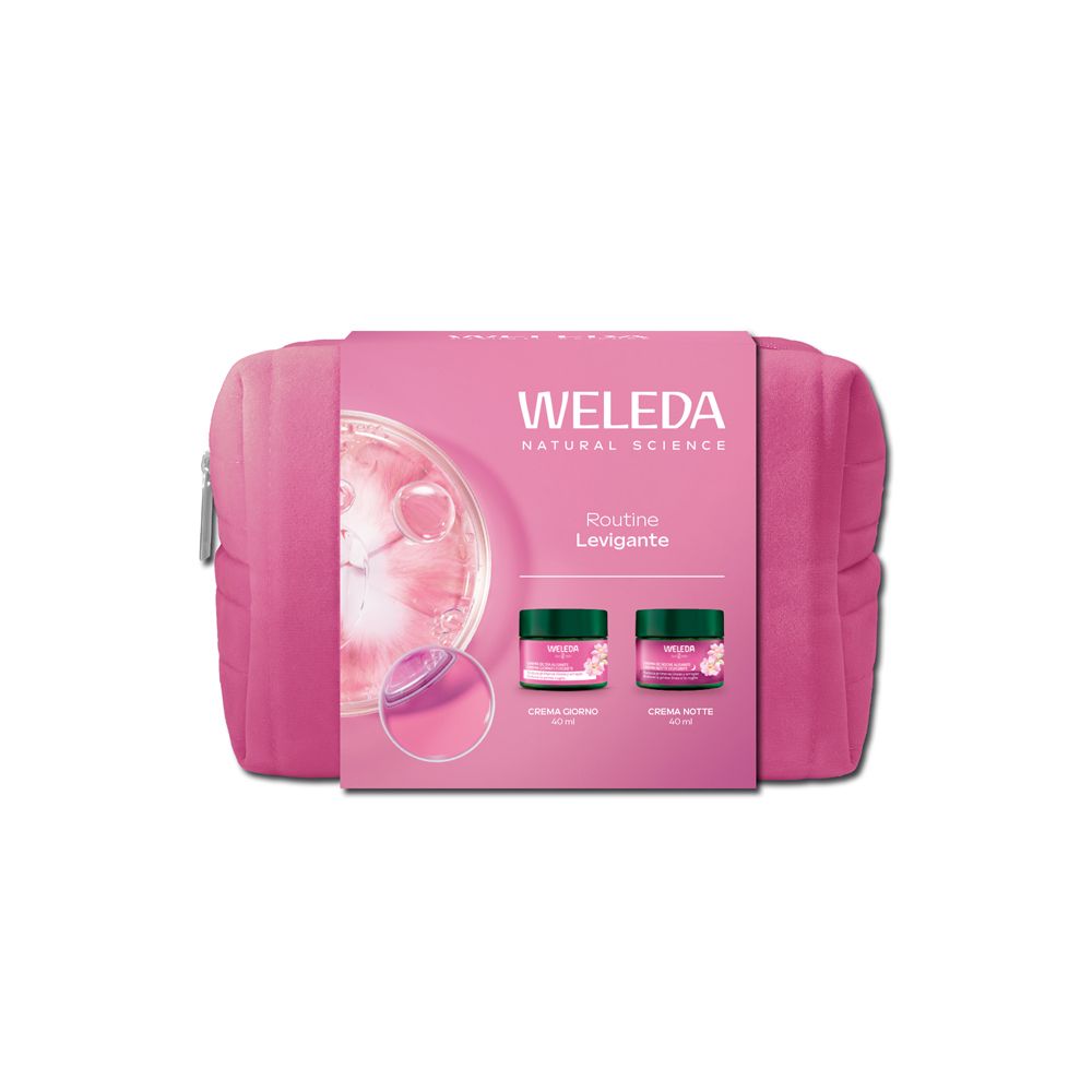 Pochette rosa con confezione. Sulla confezione sono visibili il marchio e il nome del prodotto, con due vasetti di crema illustrati.