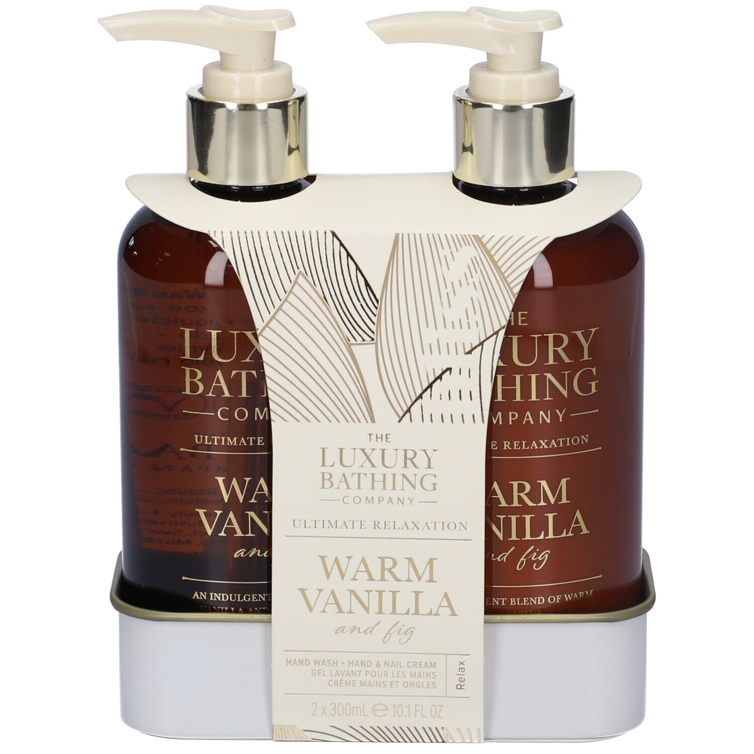 Due flaconi marroni con dosatore in supporto bianco. Scritta: Warm Vanilla and Fig.