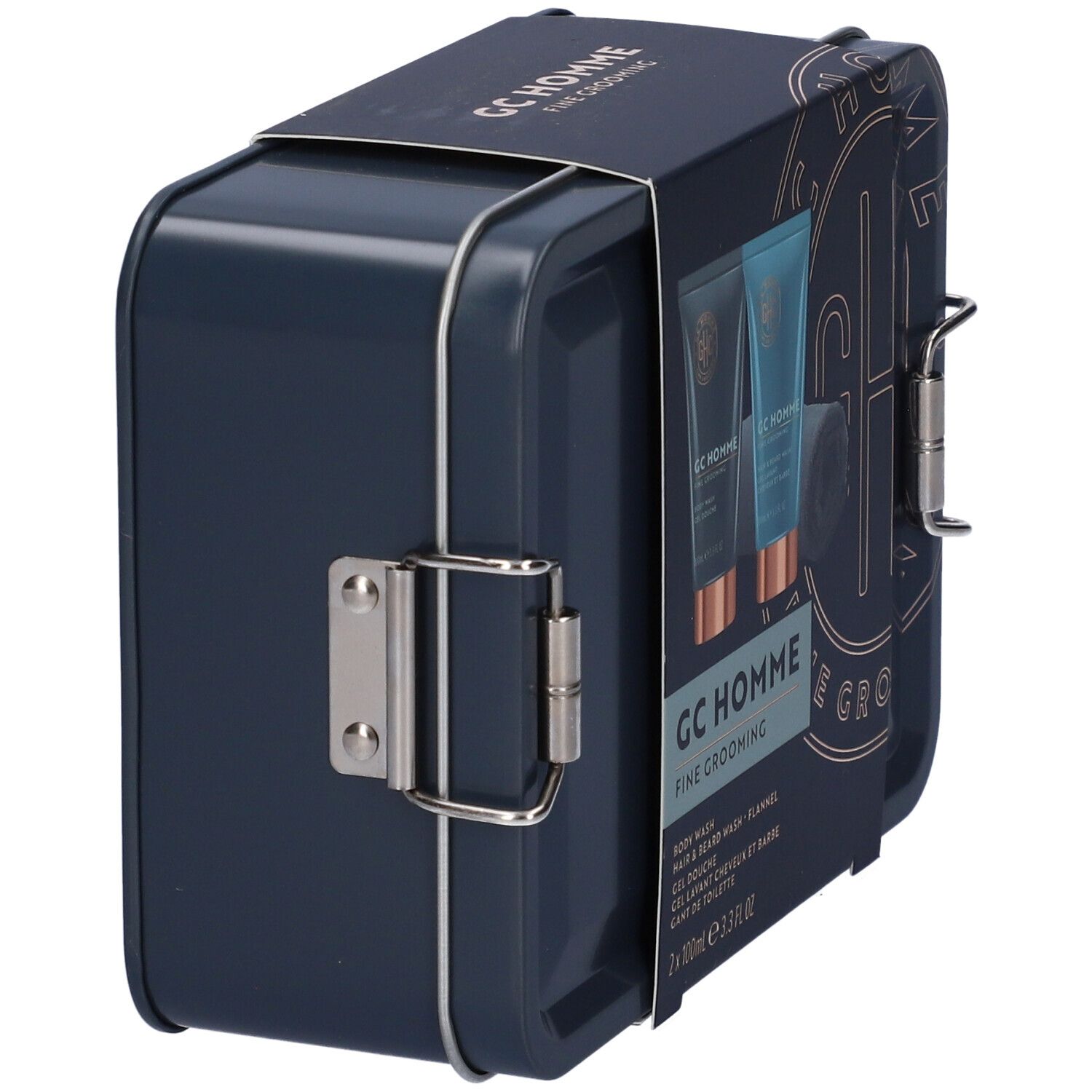 Scatola metallica blu scuro, vista laterale. Scritta: GC Homme Fine Grooming. Chiusure metalliche.